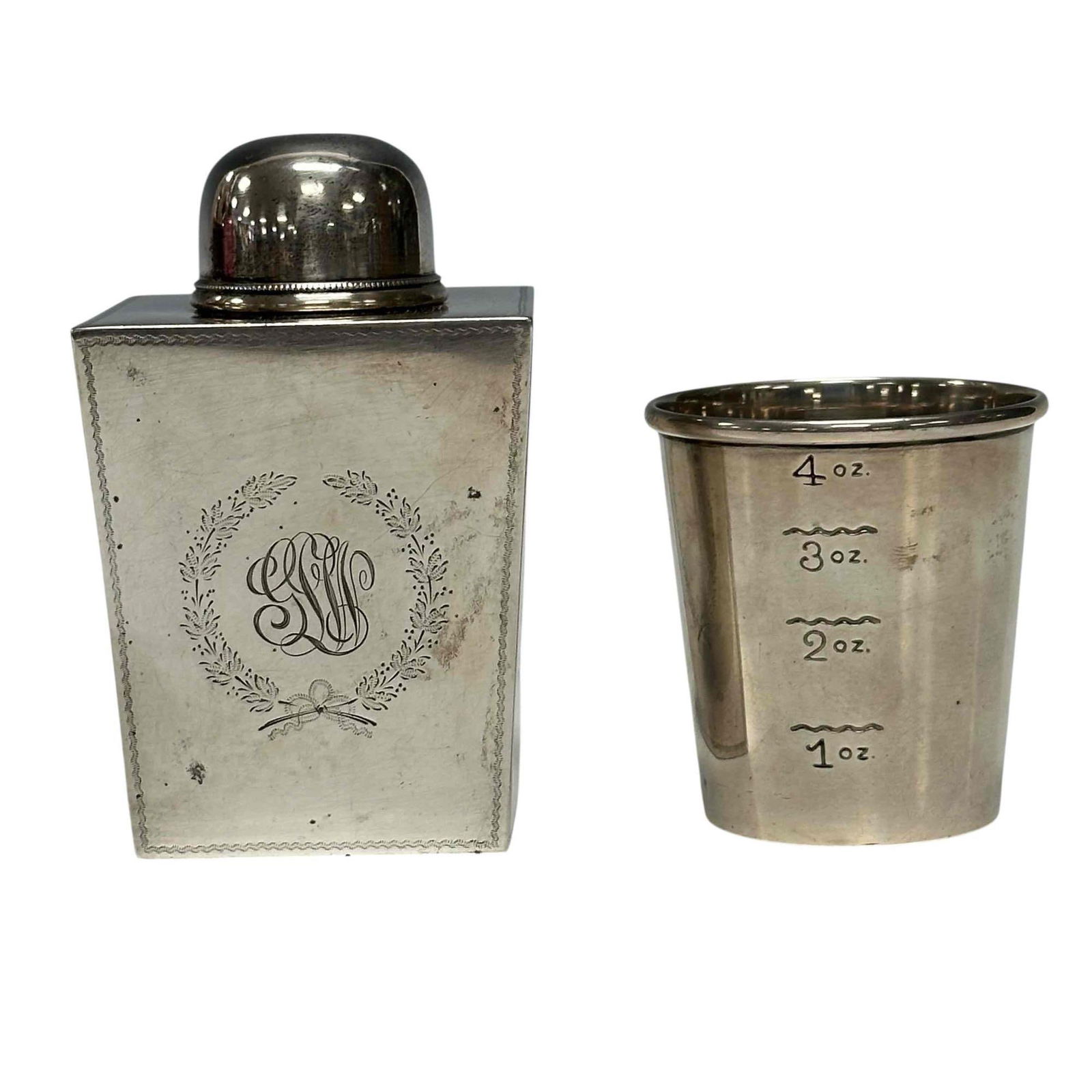 Georgian Era Sterling Tea Caddy and Measuring Cup: Black Starr and Frost sterling silver Goodnow and Jenks Tea Caddy with lead approx 4" tall and Newport sterling measuring cup 2.5" h. Both in good condition and total weight approx 200 grams.