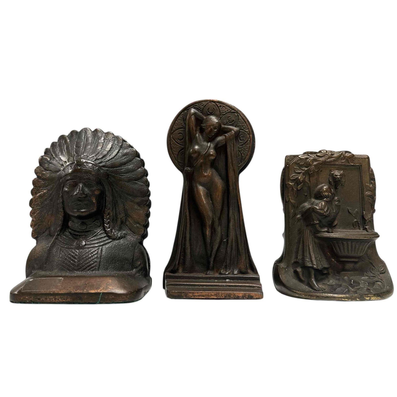 Early 20th Century Art Deco and Art Nouveau Bookends (3): Early 20th century bookends includes; bronze art nouveau "Drinking from the Fountain of Knowledge" 5.5" tall, 1920's art deco bronze patina nude woman "Keyhole" 8.5" tall and pair of bronze finished I