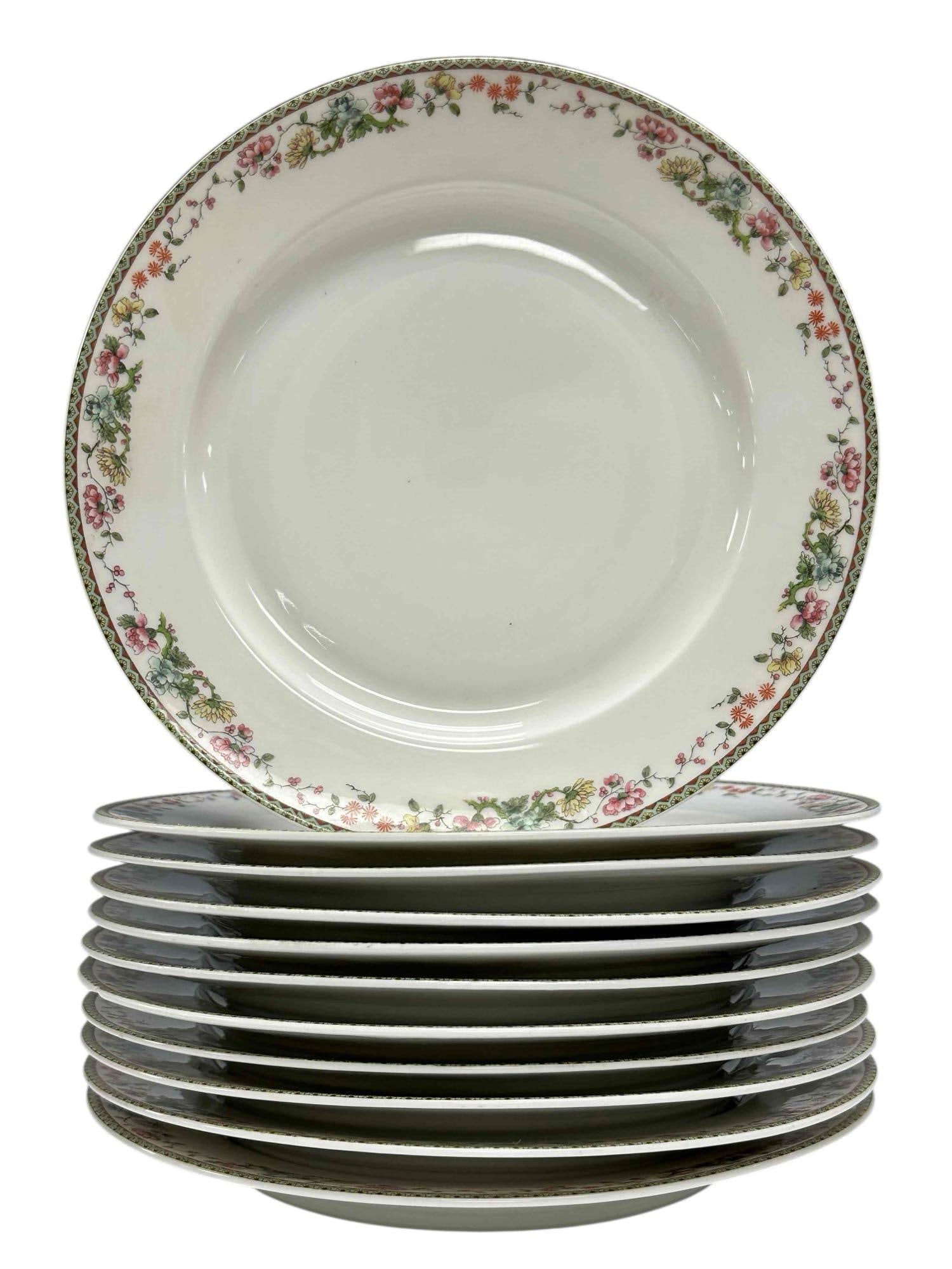 Limoges T-V (Tressemann and Vogt) Floral Dinner Plates (11): Eleven late 19th early 20th century Limoges T and V (Tressemann & Vogt) dinner plates hand-painted pink and white flowers, often described as roses or blossoms, with gold trim and often set agains