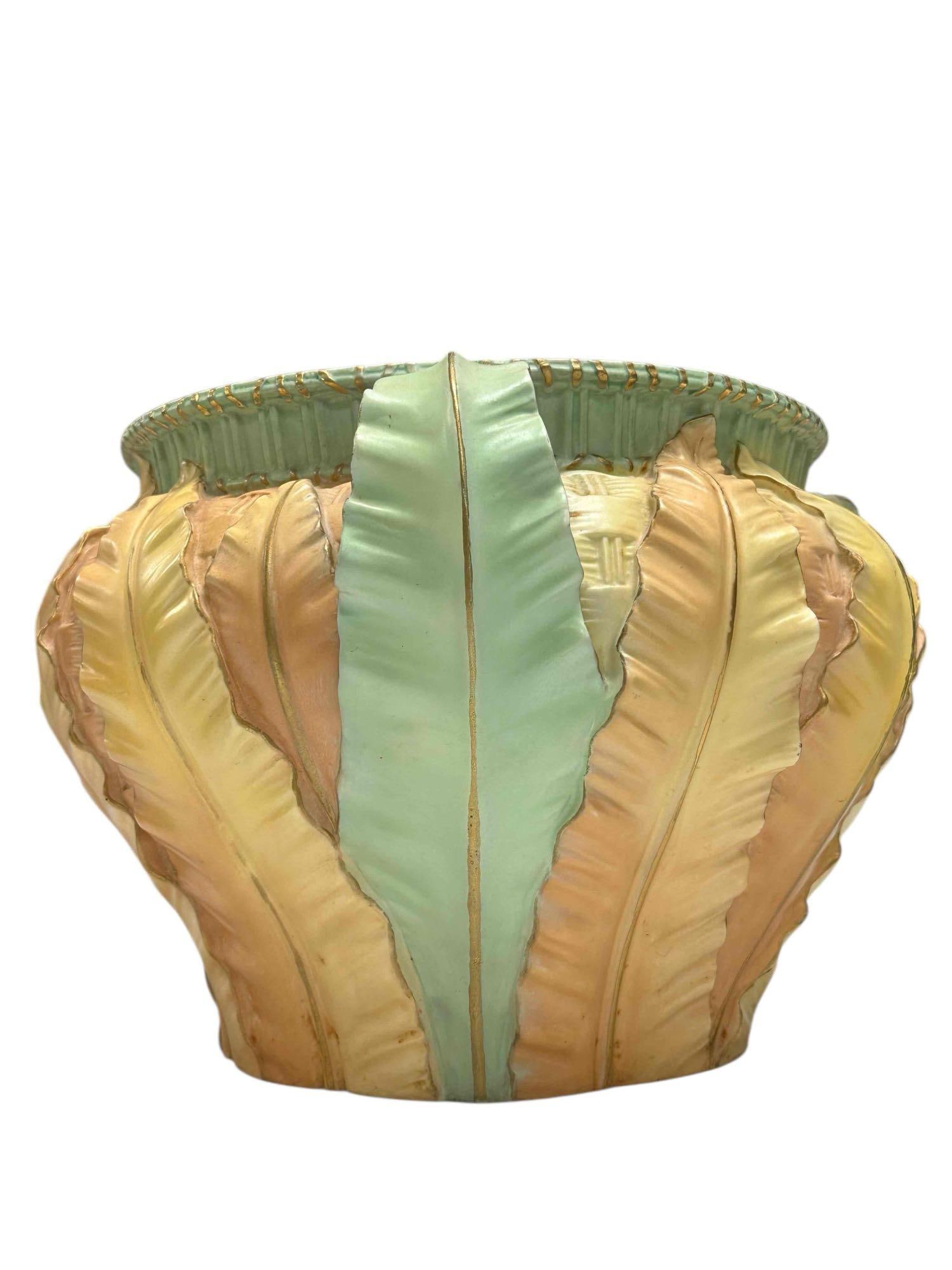 Circa 1900 Royal Worcester Blush Ivory Jardiniere: Circa 1900 Royal Worcester Blush Ivory Jardiniere three handled. Inspired by organic forms of the acanthus leaf in soft pastel colors of yellow, peach and green with gold stitch pattern rim. Measuring