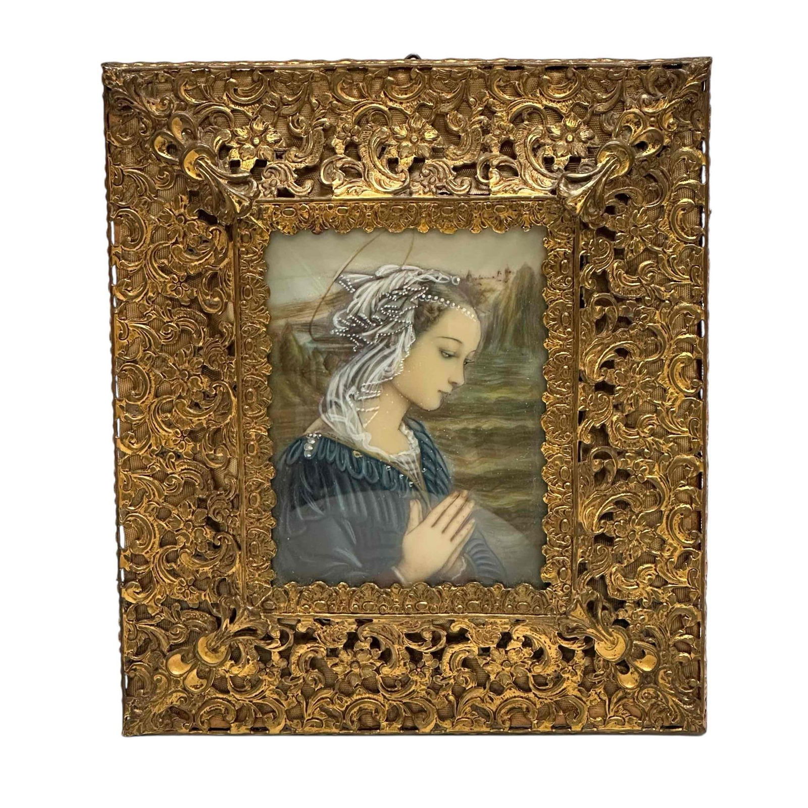 Madonna by Lippi in Ornate Filigree Gold Gilt Frame: Hand painted art of famous Renaissance painting of "Madonna and Child with Two Angels" by artist Filippo Lippi. Framed in ornate metal gold gilt filigree frame over tapestry background. Measuring appr