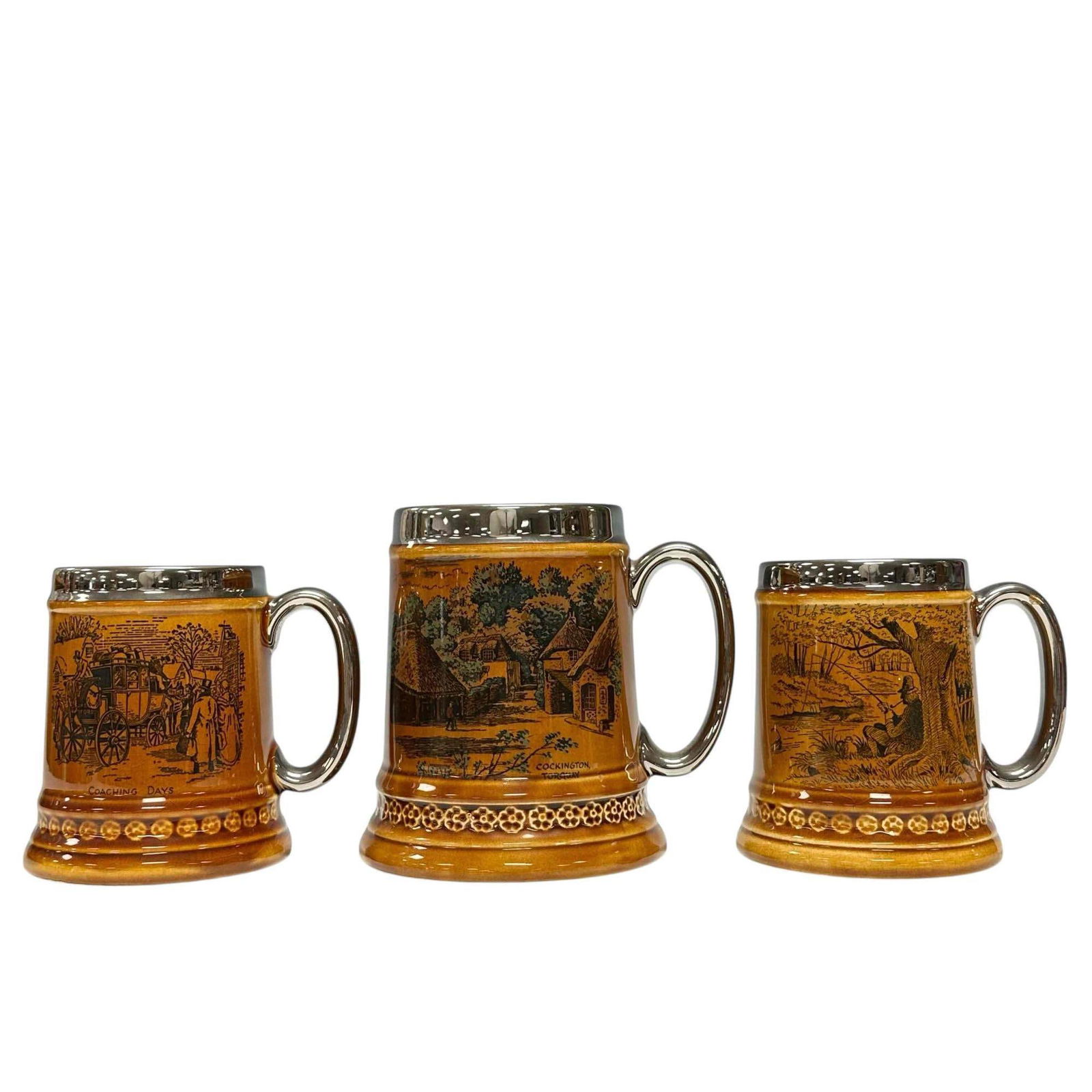 Three (3) LORD NELSON Pottery Mugs: Two measuring approx 5" tall with fishing scene and coaching days. One taller 6" tall mug Cockington Torquay village scene. All in good age appropriate condition. circa 1930-1950. See photos