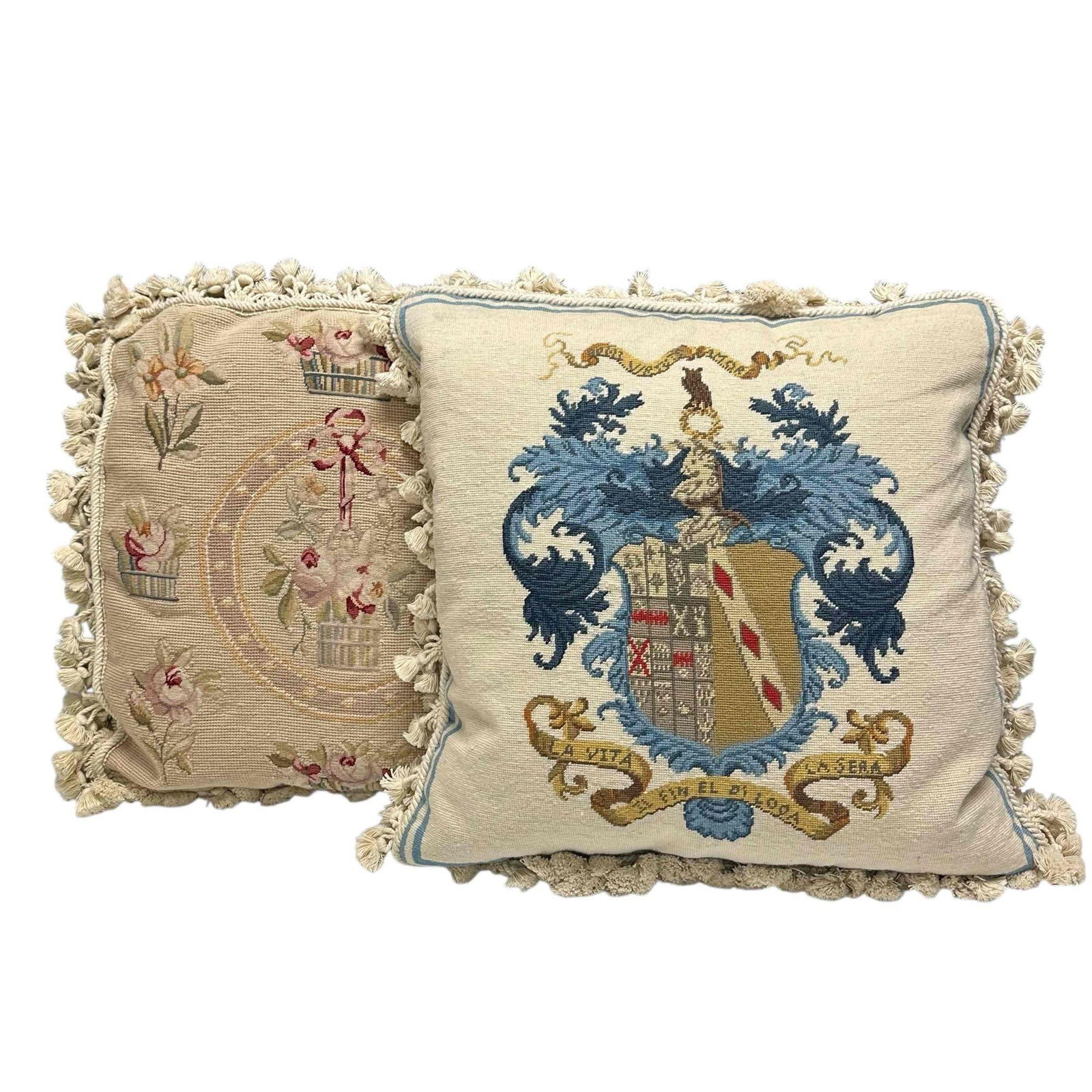 Needlepoint Pillows Floral and Family Coat of Arms (2): Vintage hand stitched wool needlepoint pillows with tassels. One depicting family crest coat of arms motto reading "Light life and Living Hope" in Italian and second having floral decor with hanging f