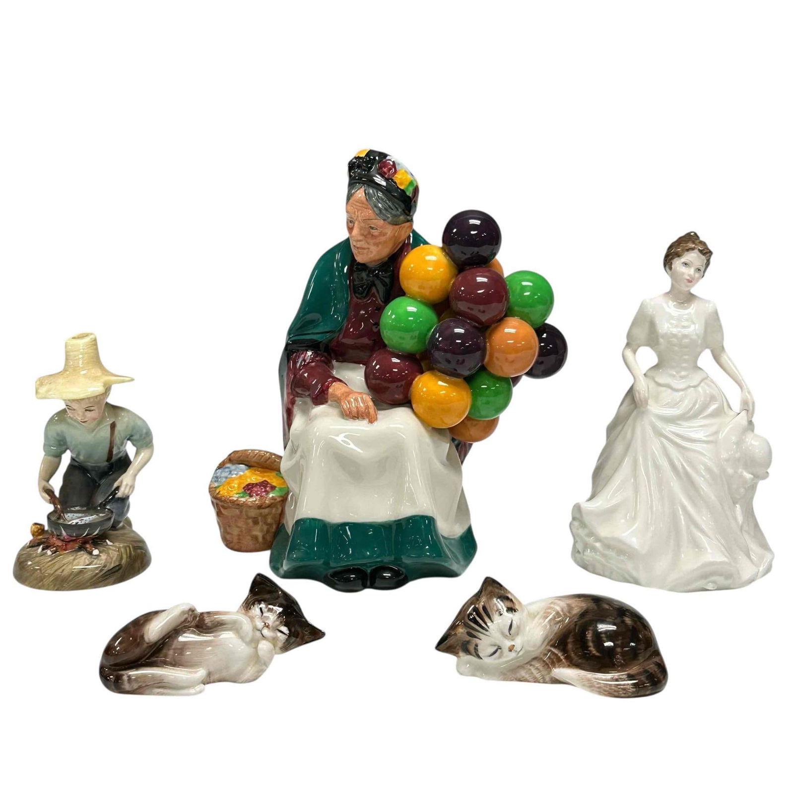 Royal Doulton Porcelain Figurine Collection (5): Including; "River Boy" 4.25" tall, two playing kittens 3.25" long, "Harmony" HN 4096 Collectors Club 6" tall and "The Old Balloon Seller" HN 1315 7.25" tall. All in good condition with no chips or bre
