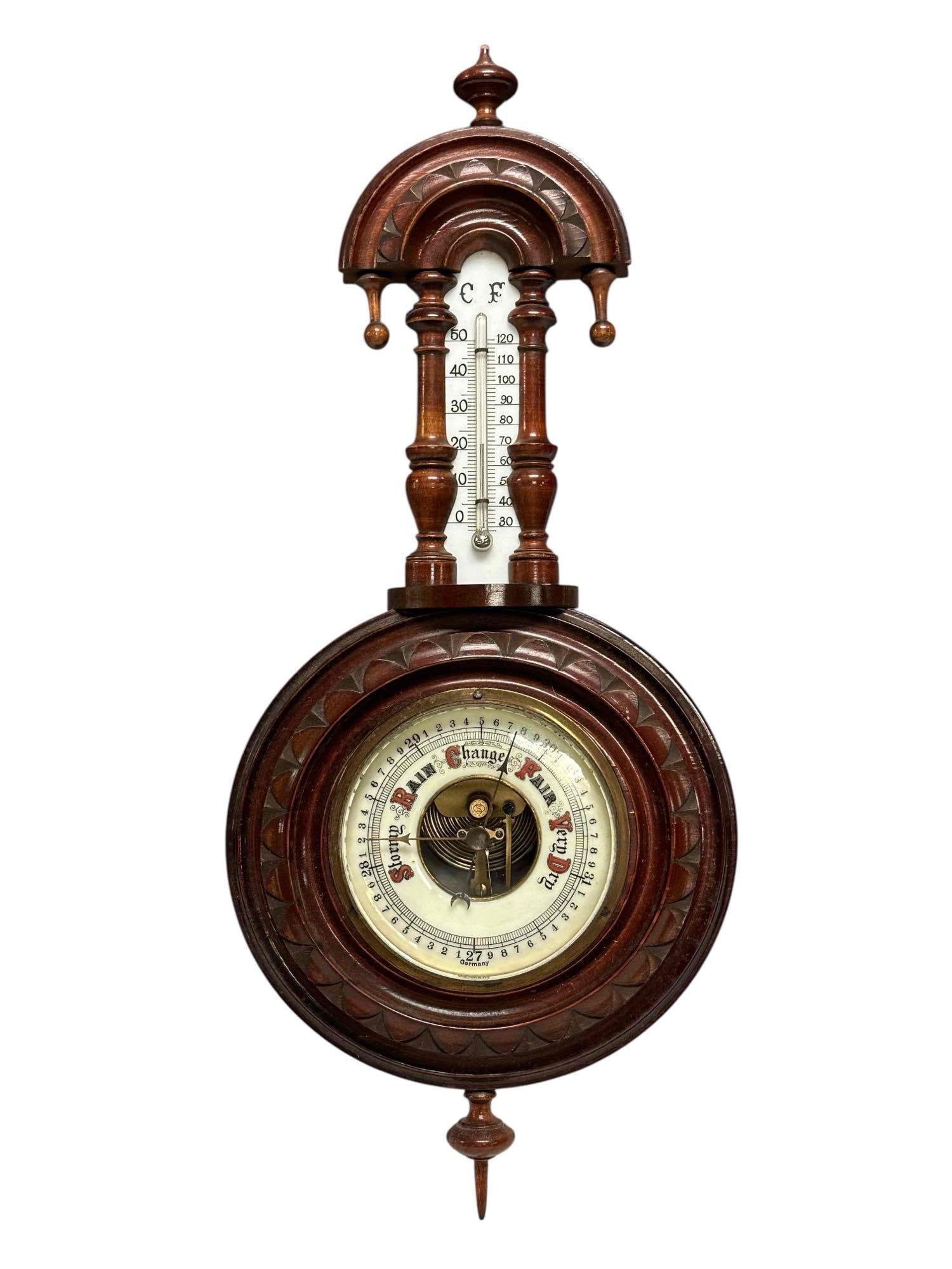 Victorian Walnut Banjo Aneroid Barometer Thermometer Weather Station: Carved walnut Victorian era banjo-style aneroid barometer and thermometer porcelain dial weather station wall hanger. Measuring approx. 17.5" tall to top finial. In good age appropriate condition with
