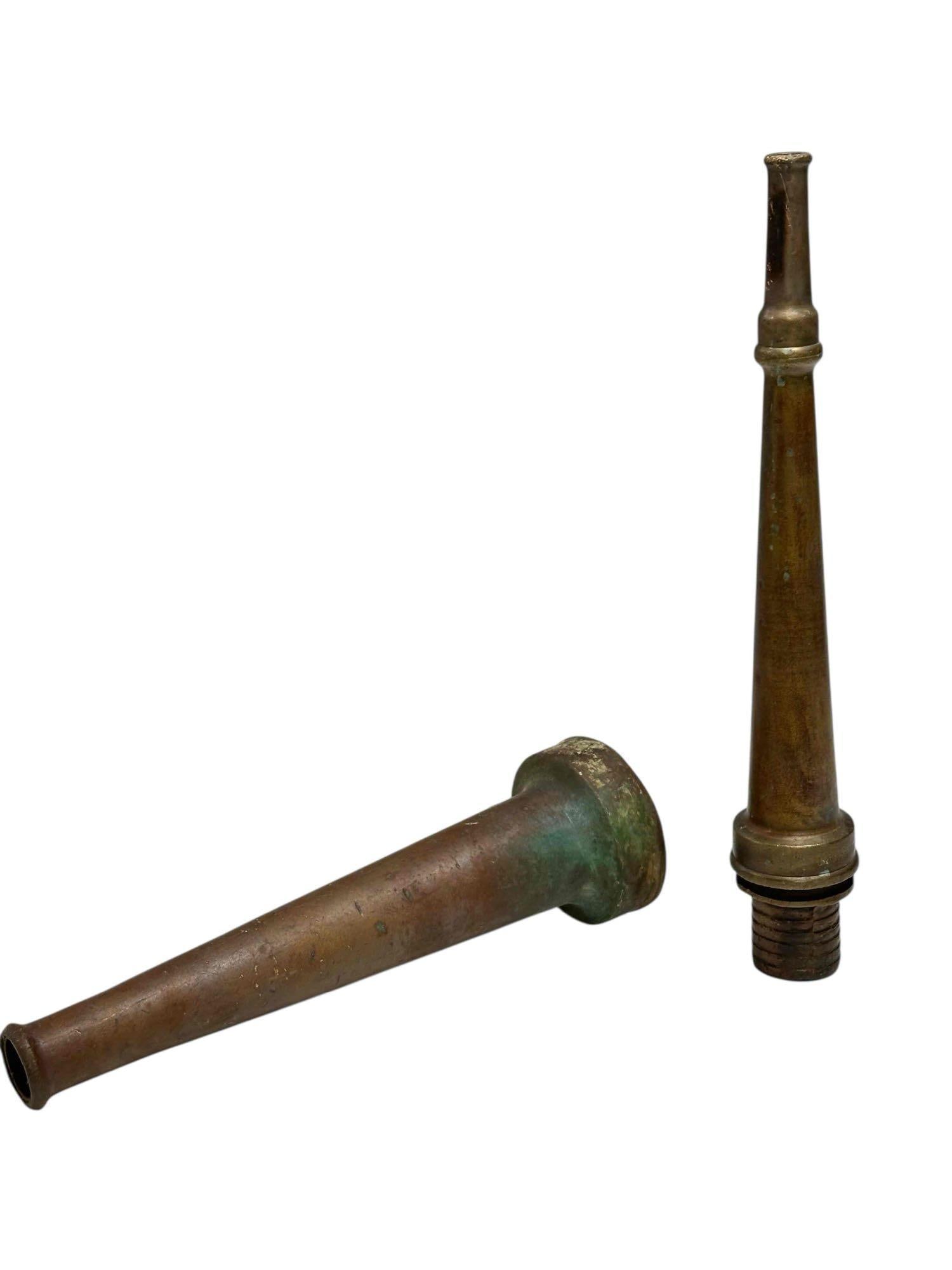Antique Brass Fire Hose Nozzles (2): late 19th century Boston Woven Hose and Rubber Co. brass fire hose nozzle 14" long and early primitive 12" brass nozzle. In age appropriate condition, see photos.