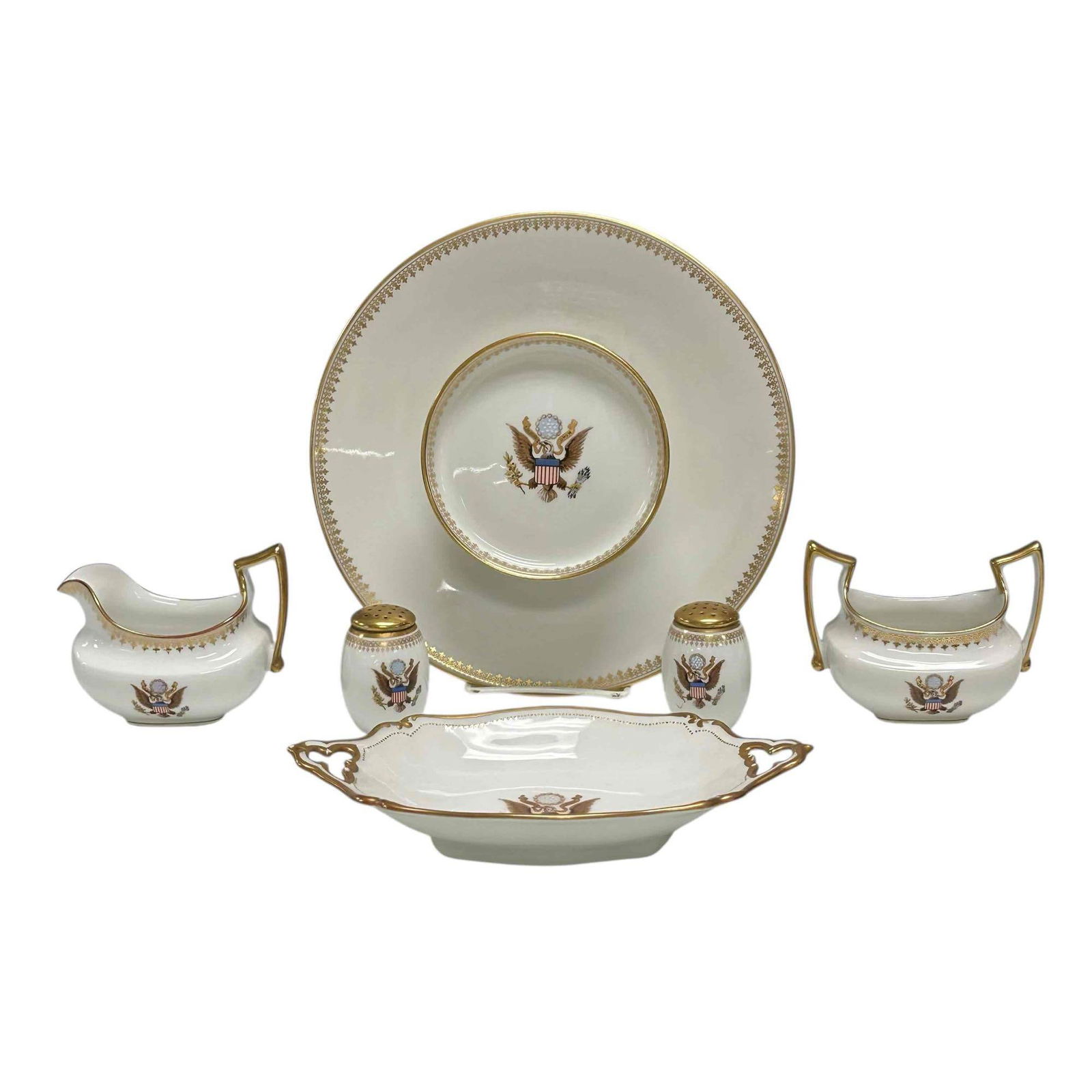 Limoges "The National Remembrance Shop" Washington D.C (6): Six piece Limoges porcelain "The National Remembrance Shop" serving piece. All pieces displaying the United States of America Coat of Arms. Includes; salt and pepper, cream and sugar, pedestal platter