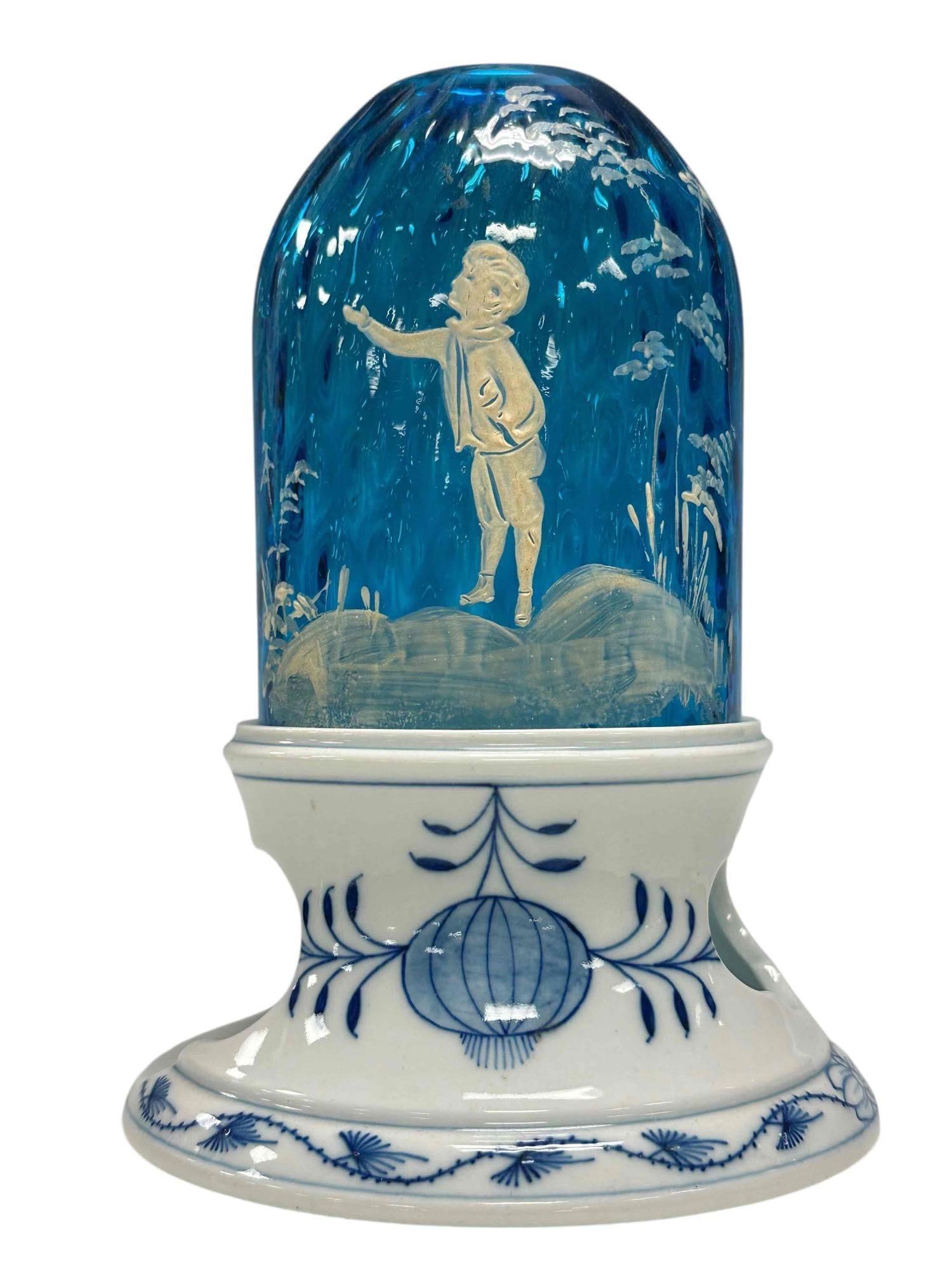 Mary Gregory with Meissen Blue Onion Base Fairy/Glimmer Lamp: Meissen Blue Onion pattern base married with Mary Gregory sapphire blue white enameled shade candle light lamp. Measuring approx. 7.25" tall. In good age appropriate condition with small flea bite rim