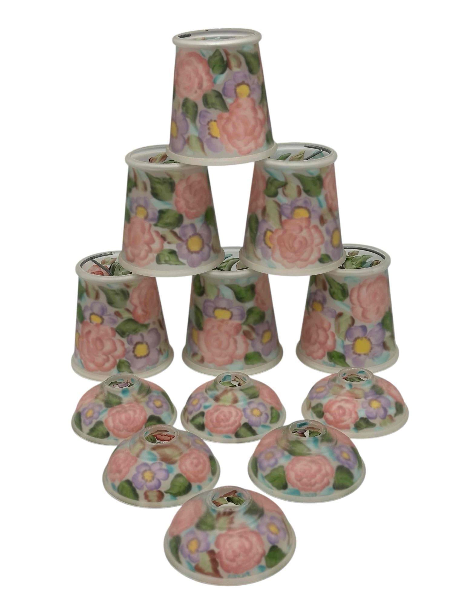 Arts and Crafts Reverse Painted Glass Chandelier Slide Shades (6): Artist signed reverse painted floral decor individual chandelier shades with bulb slips and matching painted under bulb shades. Signed Shell and Goldie. Measuring approx. 4.5" tall. In good condition,