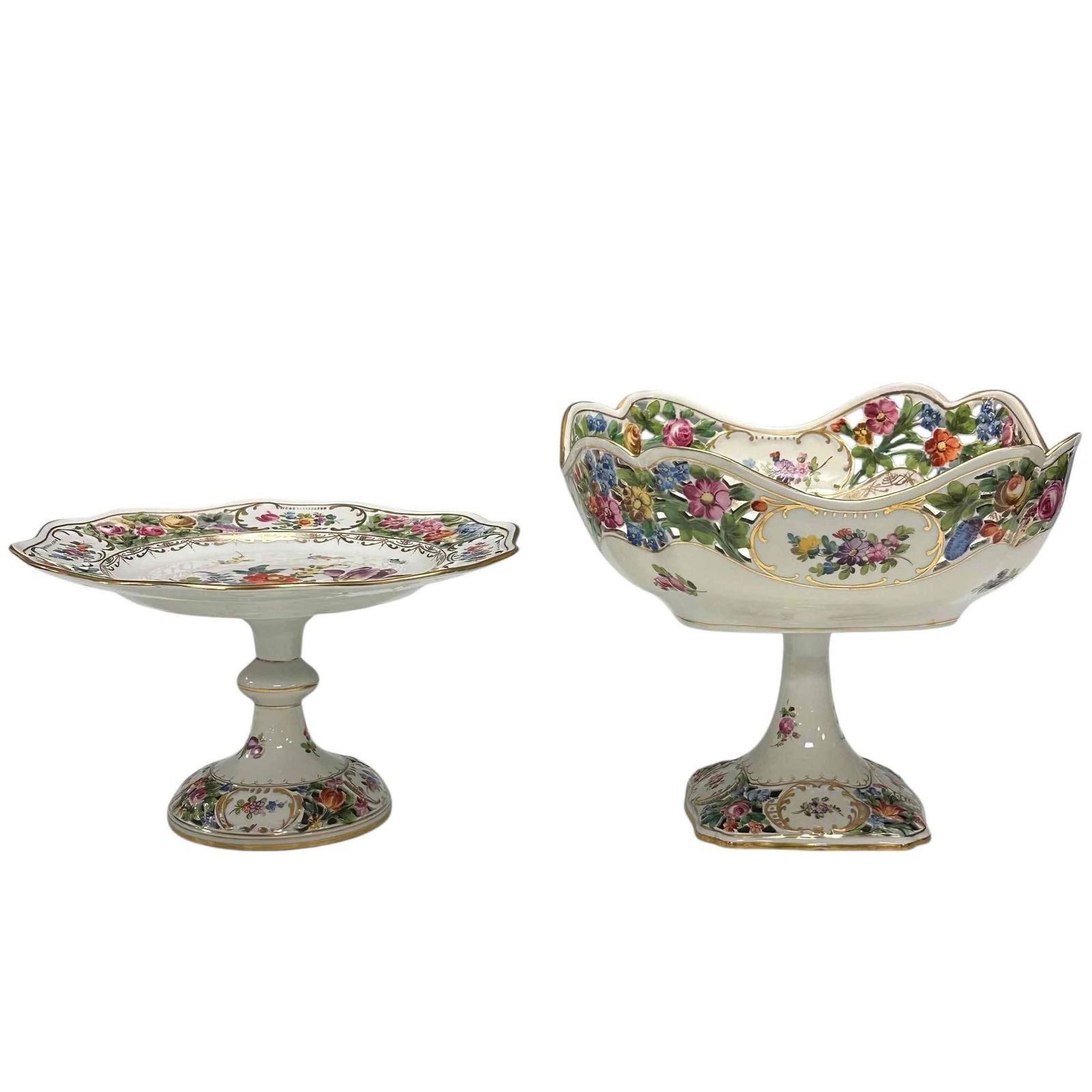 Carl Thieme Dresden Porcelain Pedestal Fruit and Cake Dishes (2): Early 20th century hand painted openwork porcelain Dresden by Carl Thieme. Reticulated pedestal centerpiece fruit bowl 8.5" tall by 10" diameter and compote cake plate 5.75" tall by 10" diameter. Both