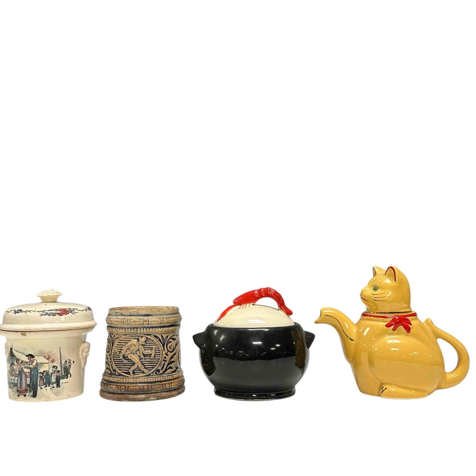 Vintage Pottery Stoneware Collectible Vessels Group (4): Includes; yellow cat body teapot with green eyes 5.75" tall, Sarreguemines Simplex stoneware lidded crock, 4.5" tall with chip to finial, German stoneware cobalt blue stein mug 4" tall with chips to r