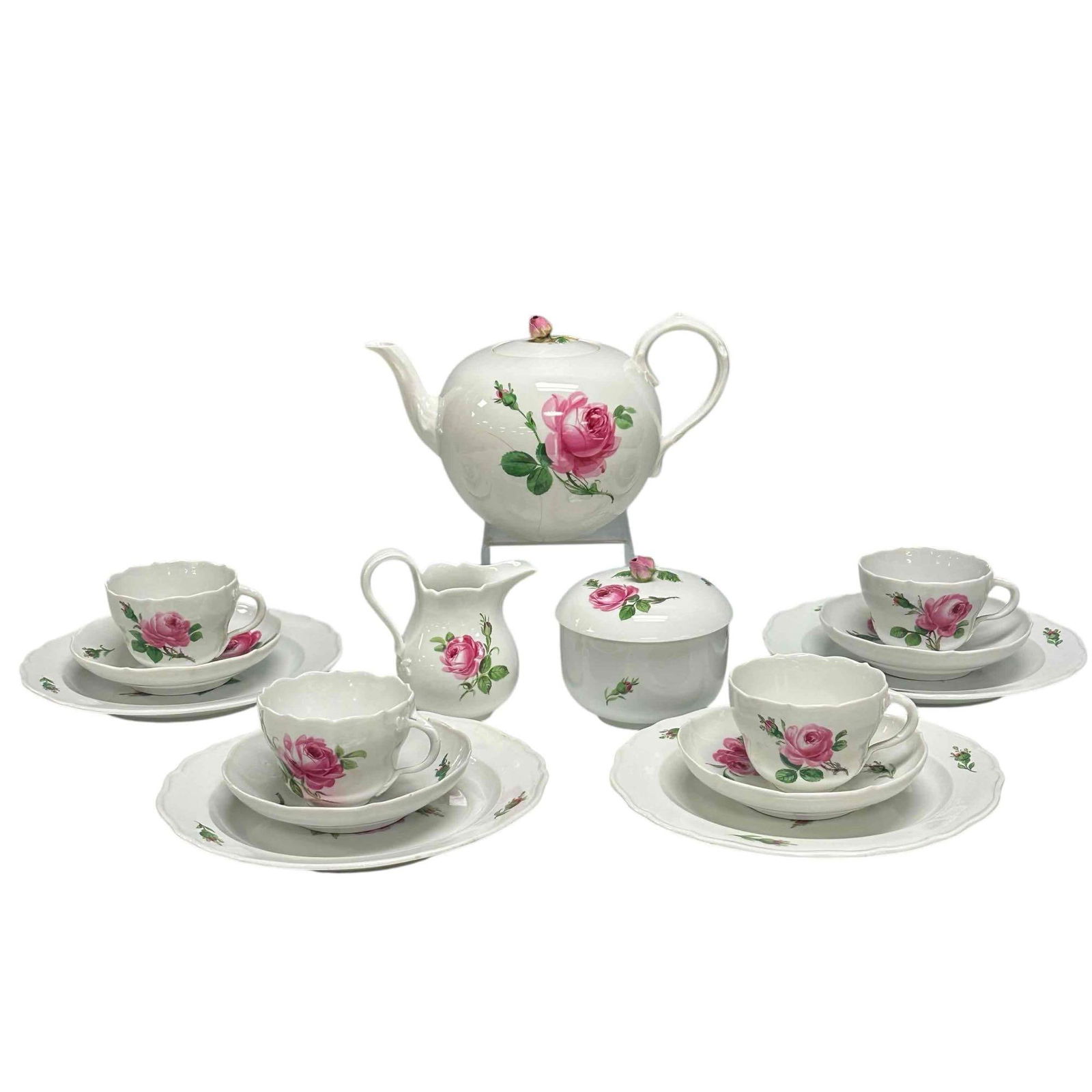 Meissen "Pink Rose" Service for 4 Tea Set: Meissen porcelain "Pink Rose" pattern tea set. Complete service for four including; cream and sugar 4" to 4.5" tall, 4 cups, 4 saucers 5.5" diameter, 4 biscuit plates 8.5" diameter and teapot 6" tall.