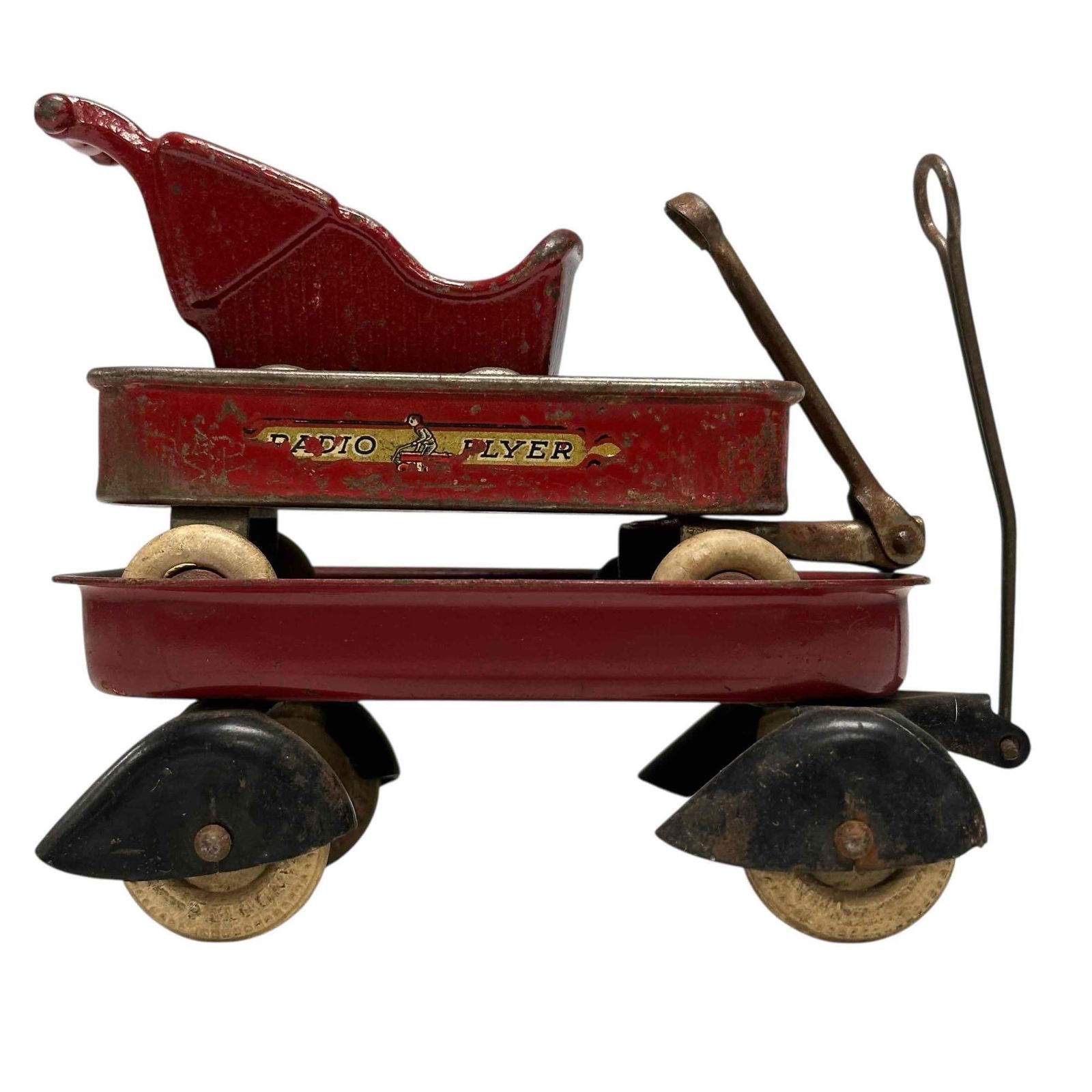 Pressed Steel and Cast Iron Wagons Stroller (3): Early 20th century pressed steel Radio Flyer wagon 4" with functional wheel and handle, Wyandotte pressed steel streamline fenders functional wagon 5" and cast iron stroller 3". In good age appropriat