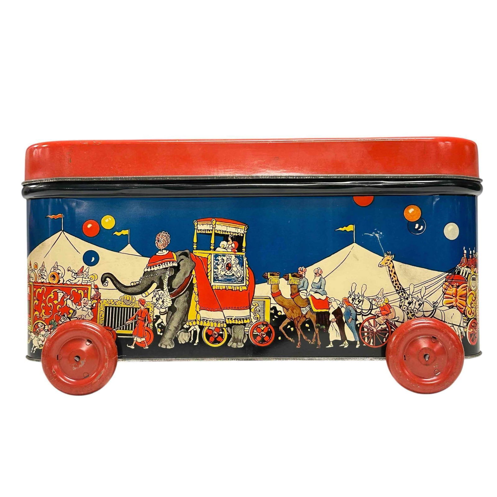 1930's "The Great Supreme Biscuit Animal Show" Tin Lito Container on Wheels: Circus themed tin lithograph "The Great Supreme Animal Show" container on wheels. Depicting circus parade of elephants, camels, clowns and circus tents. Measuring approx. 14" wide by 7" tall by 9.75"