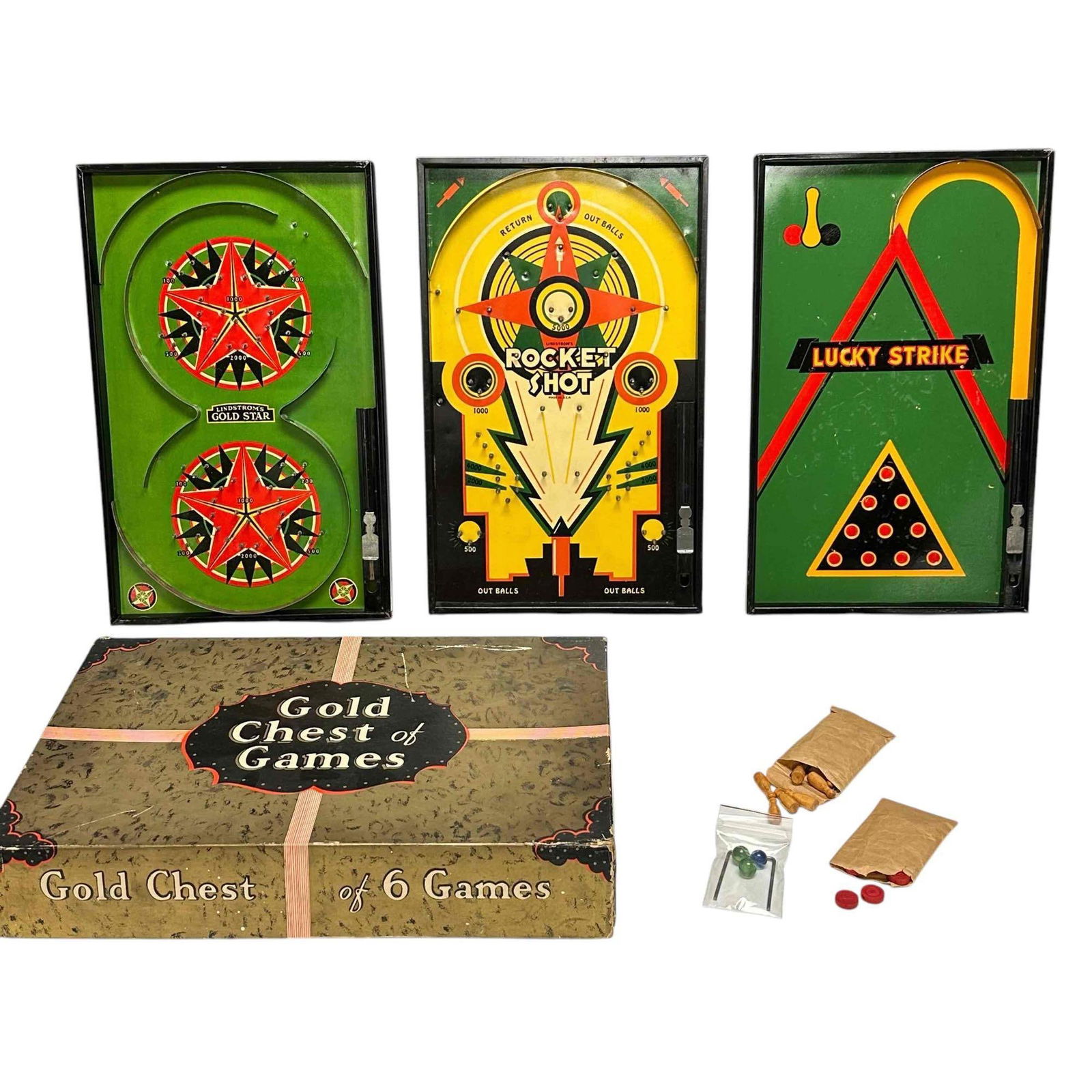 Lindstrom's Gold Chest of 6 Games w/Three Playing Boards: A gift box of games by Lindstrom's Tool and Toy Co. Contains Gold Star, Rocket Shot and Lucky Strike. Contains a small pack of marbles and the back props. Another pack of pins, and a pack of red check