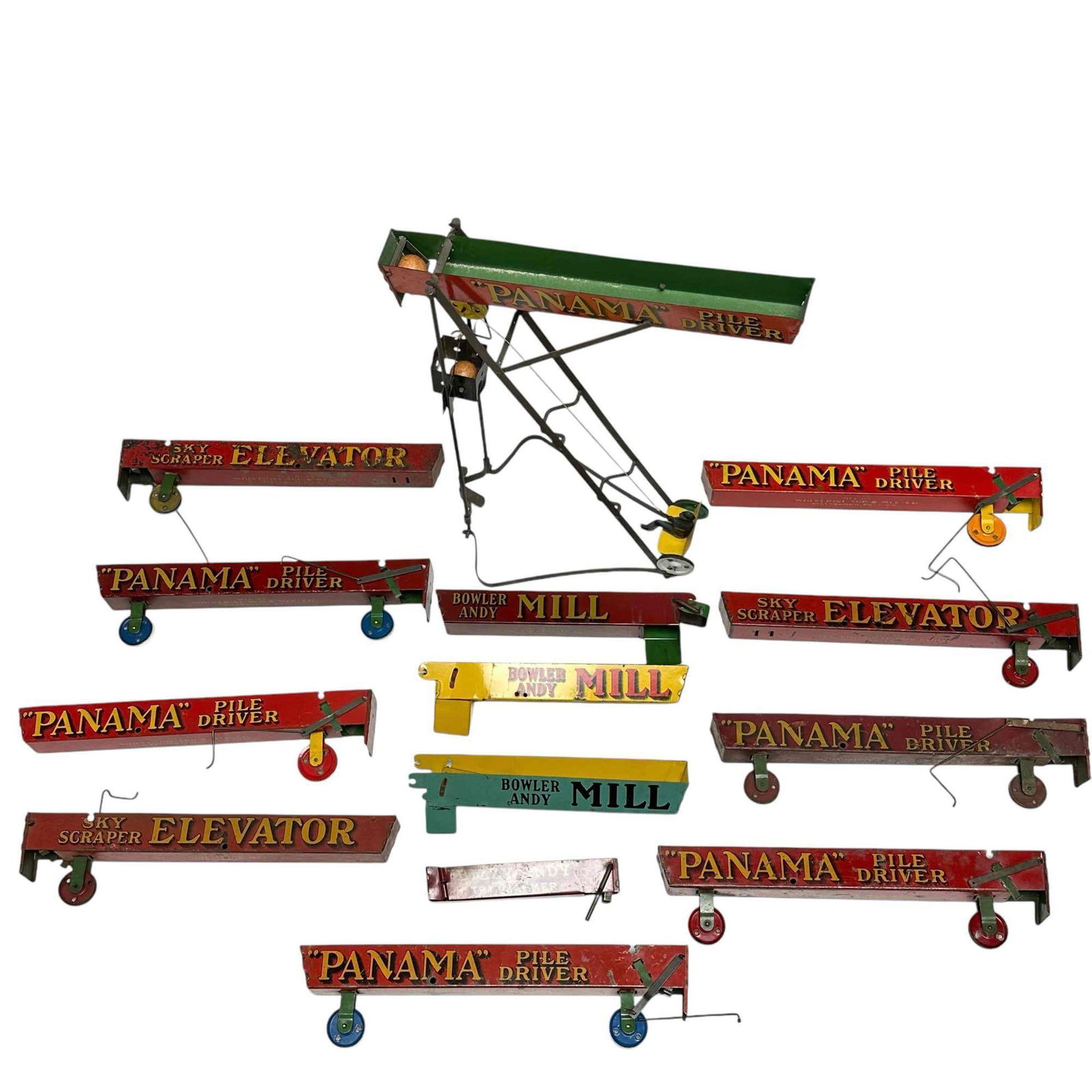 (13) WOLVERINE Tin Litho Pile Driver Spare Marble Rails: A Group of 13 spare parts for restoration or just decorative as they display great in showcases and toy collections. Various style, colors and year. On partial complete unit as well, see photos for de