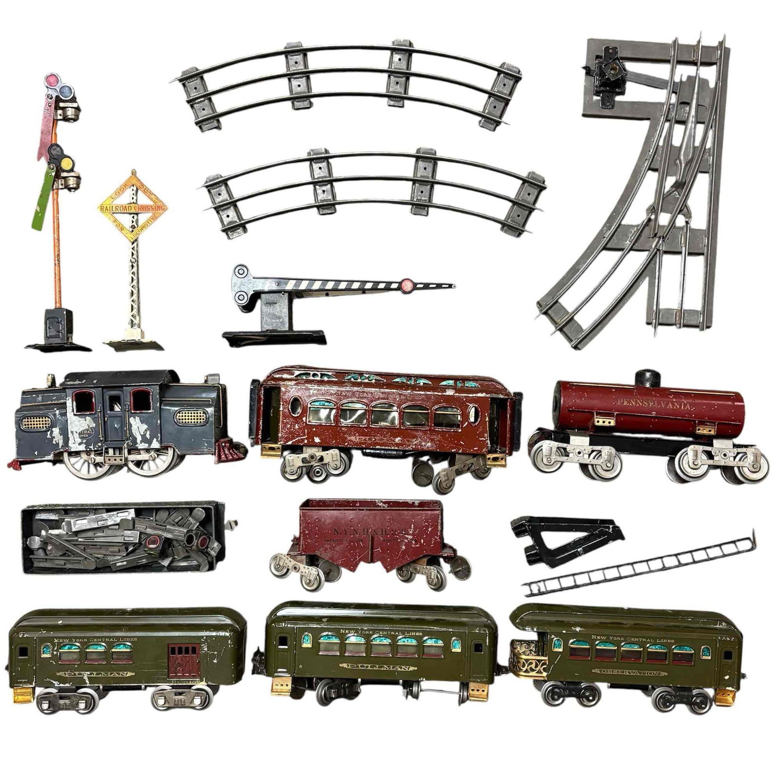 Lionel Standard Gauge Pullman "New York Central Lines" Train Set: Vintage Lionel Standard Gauge "New York Central Lines" train cars and accessories. Includes; olive green and red cars with gray locomotive 8" to 11.5" long, semaphore signal13.25" tall, railroad cross