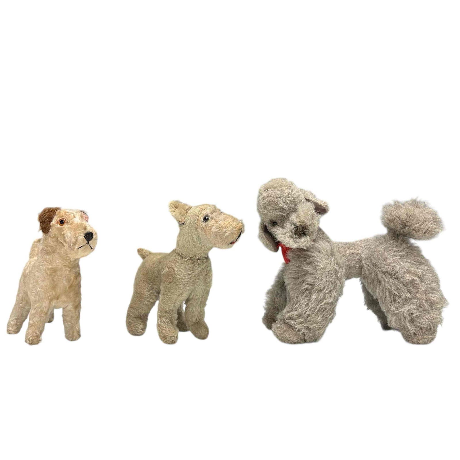 Vintage Steiff Mohair "Snobby Poodle" & "Foxy Fox" Dogs (3): Three vintage Steiff mohair dogs "Snobby Poodle" 12" long fully jointed and two early "Foxy Fox" terrier 9" long with one having head/neck repair. See photos for condition.