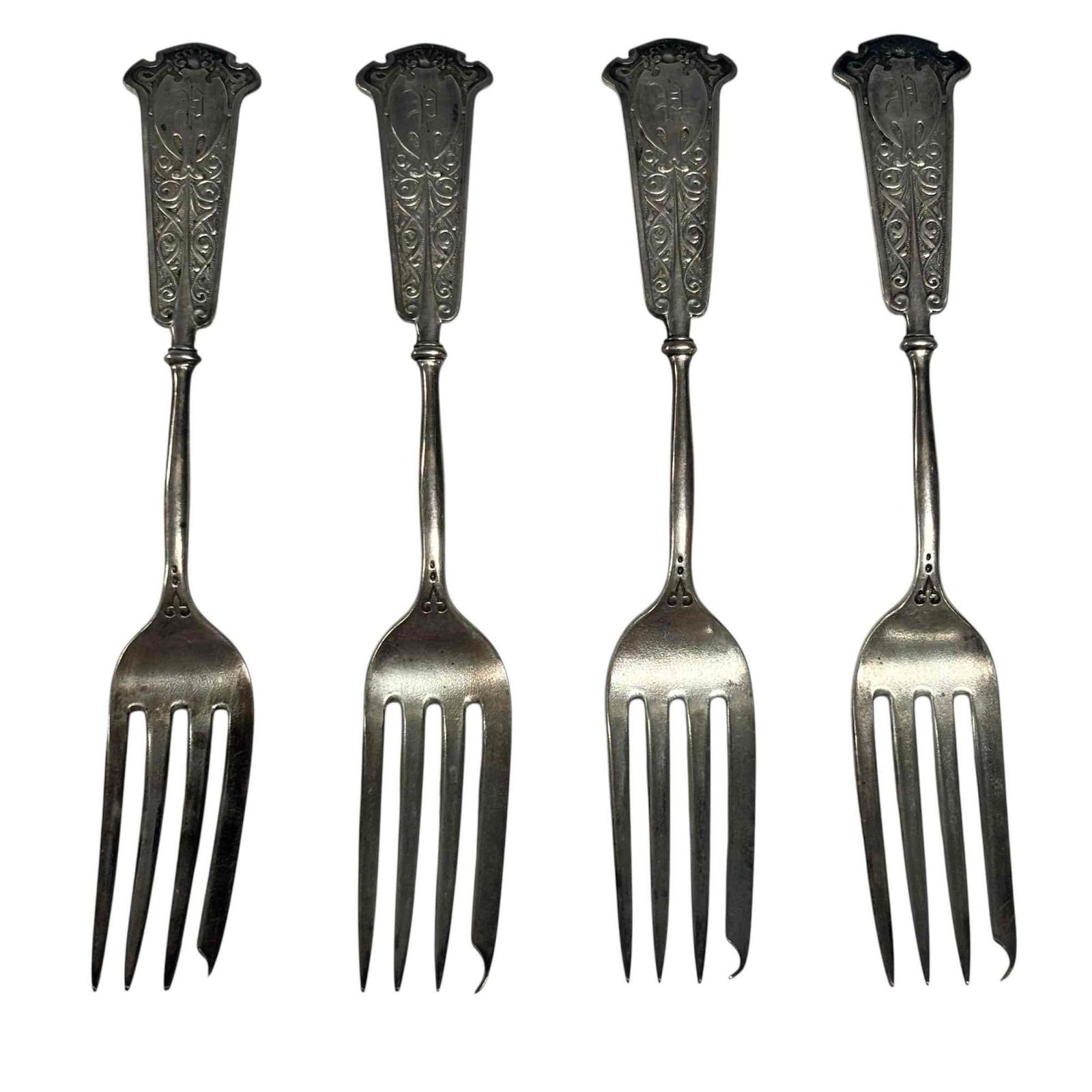 Starr and Marcus (1862-1877) Sterling Silver Forks (4): Set of four Starr and Marcus which was a prominent New York retailer 1862–1877 specializing in high-quality sterling silver flatware. Ornate scroll work with shell motif crest with bat form medallio