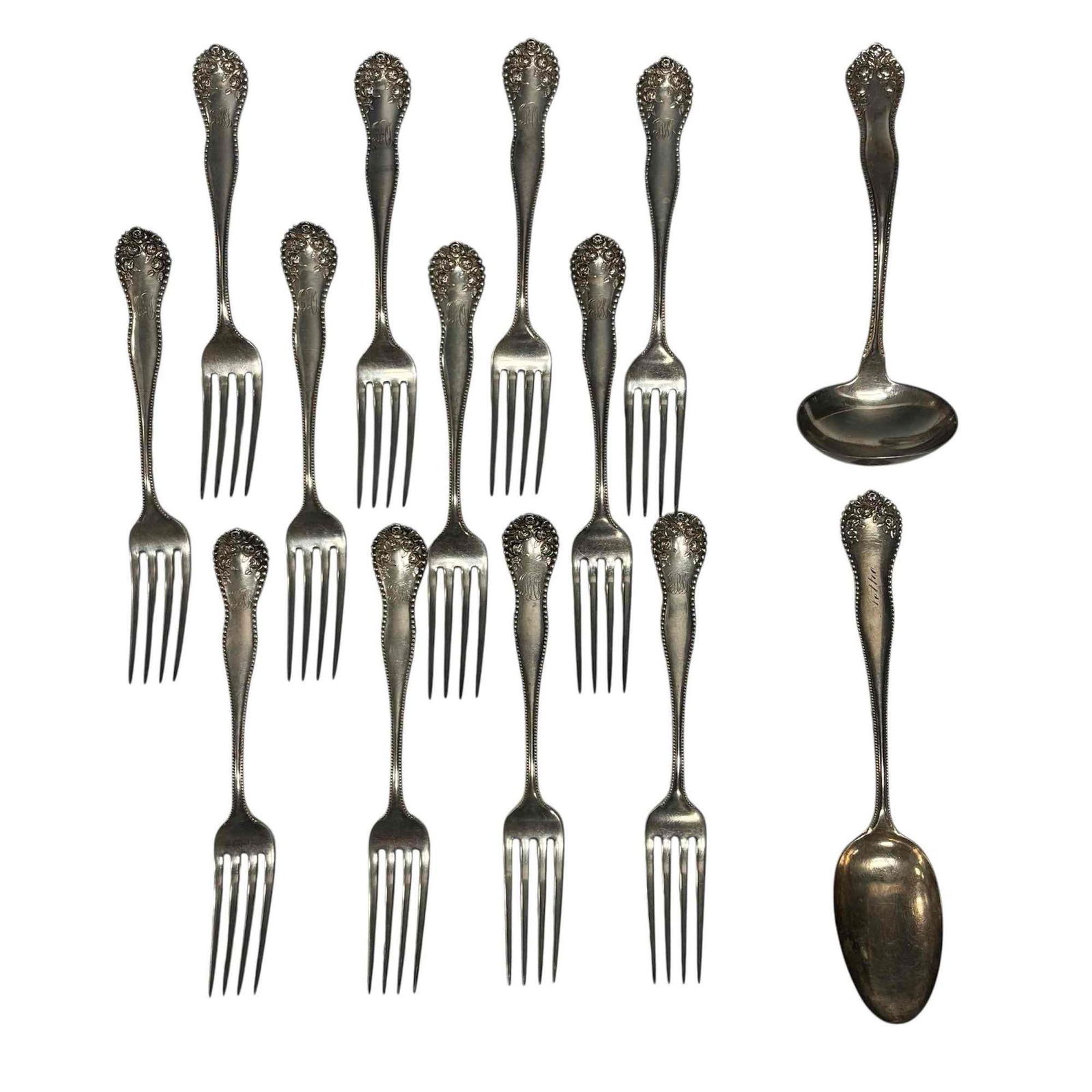 Gorham "Lancaster" Sterling Silver Flatware (14) 801 Grams: "Lancaster" pattern by Gorham for B.H. Stief sterling silver flatware. Heavily embossed rose motif with beaded borders. Includes 12 dinner forks 7.75" long, serving ladle 7" long and large serving spo