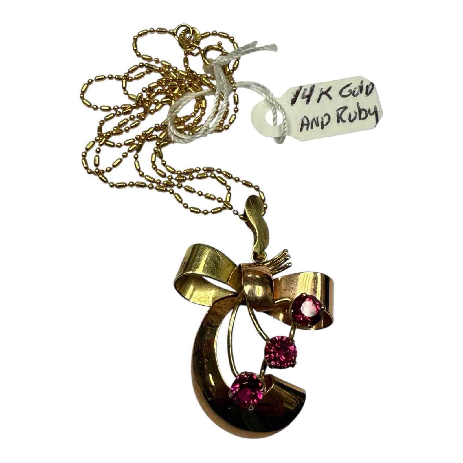 Rose & Yellow 14K Gold w/ Rubies Ladies Vintage Chain: Ribbon form pendant in rose and 14k yellow gold with crescent shape red rubies on 14k yellow gold bead chain. Pendant measuring approx. 1.25" tall with chain measuring 18" long. In good condition, see