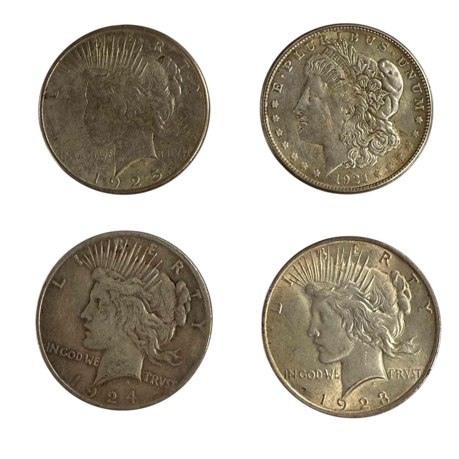 Morgan & Peace Silver Dollars (4): 1921 S Morgan silver dollar with 1923, 1924 and 1925 Peace silver dollars. See photos for condition.