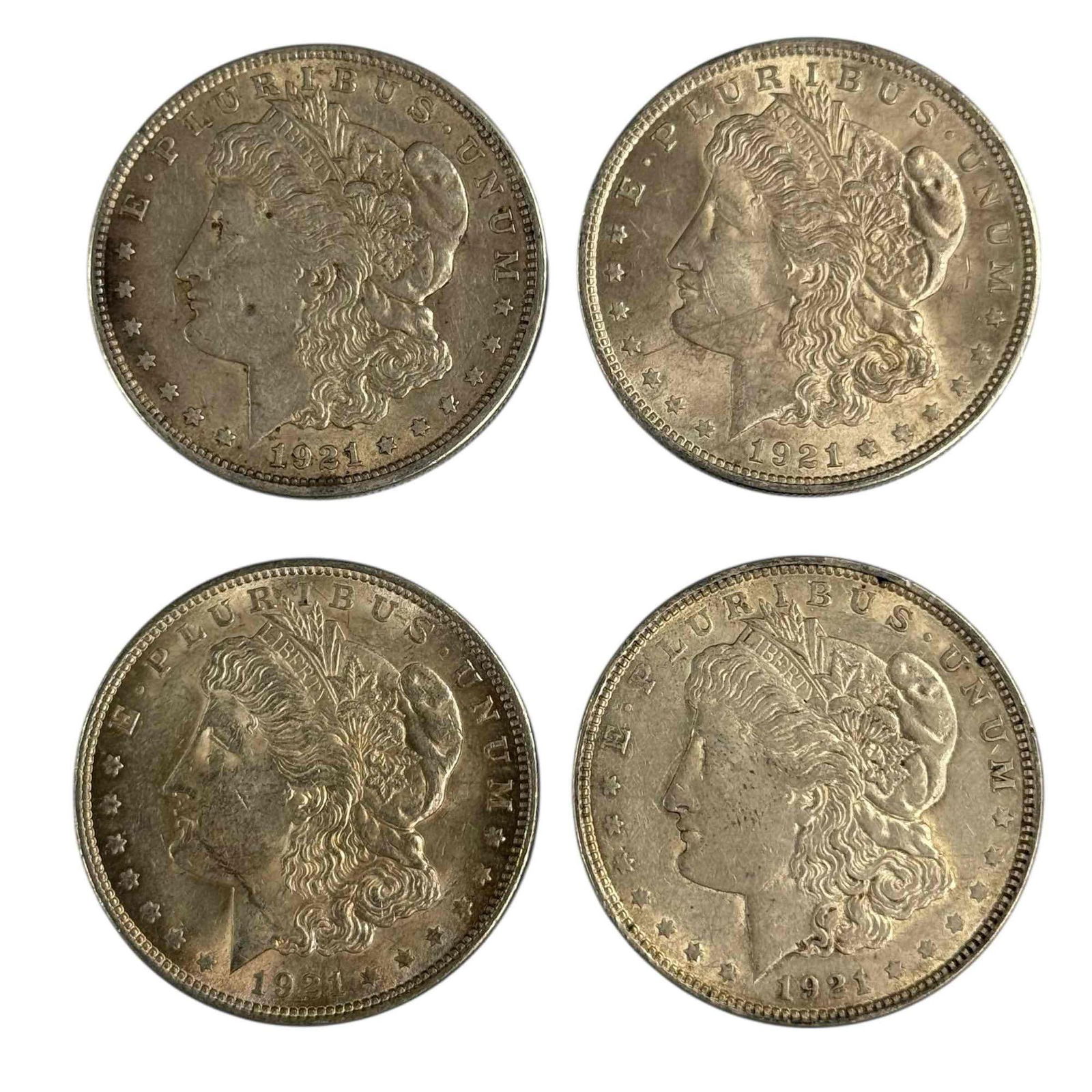 1921 Morgan Silver Dollars (4): Four 1921 Morgan silver dollars. See photos for condition.