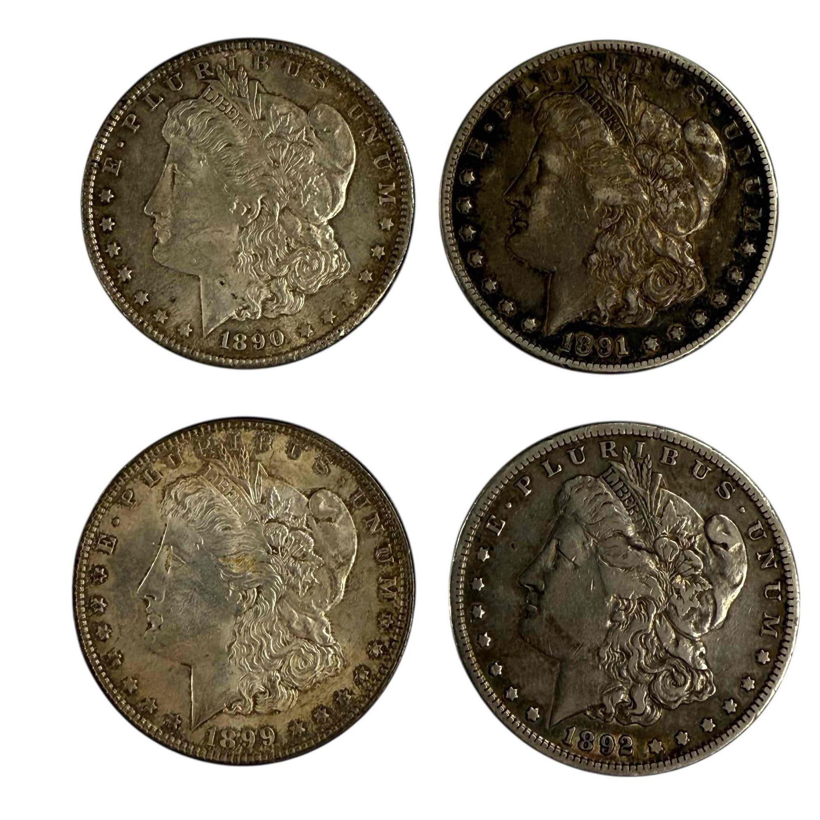 1890's Morgan Silver Dollars (4): Morgan silver dollars including; 1890, 1891 S, 1892 S and 1899. See photos for condition.