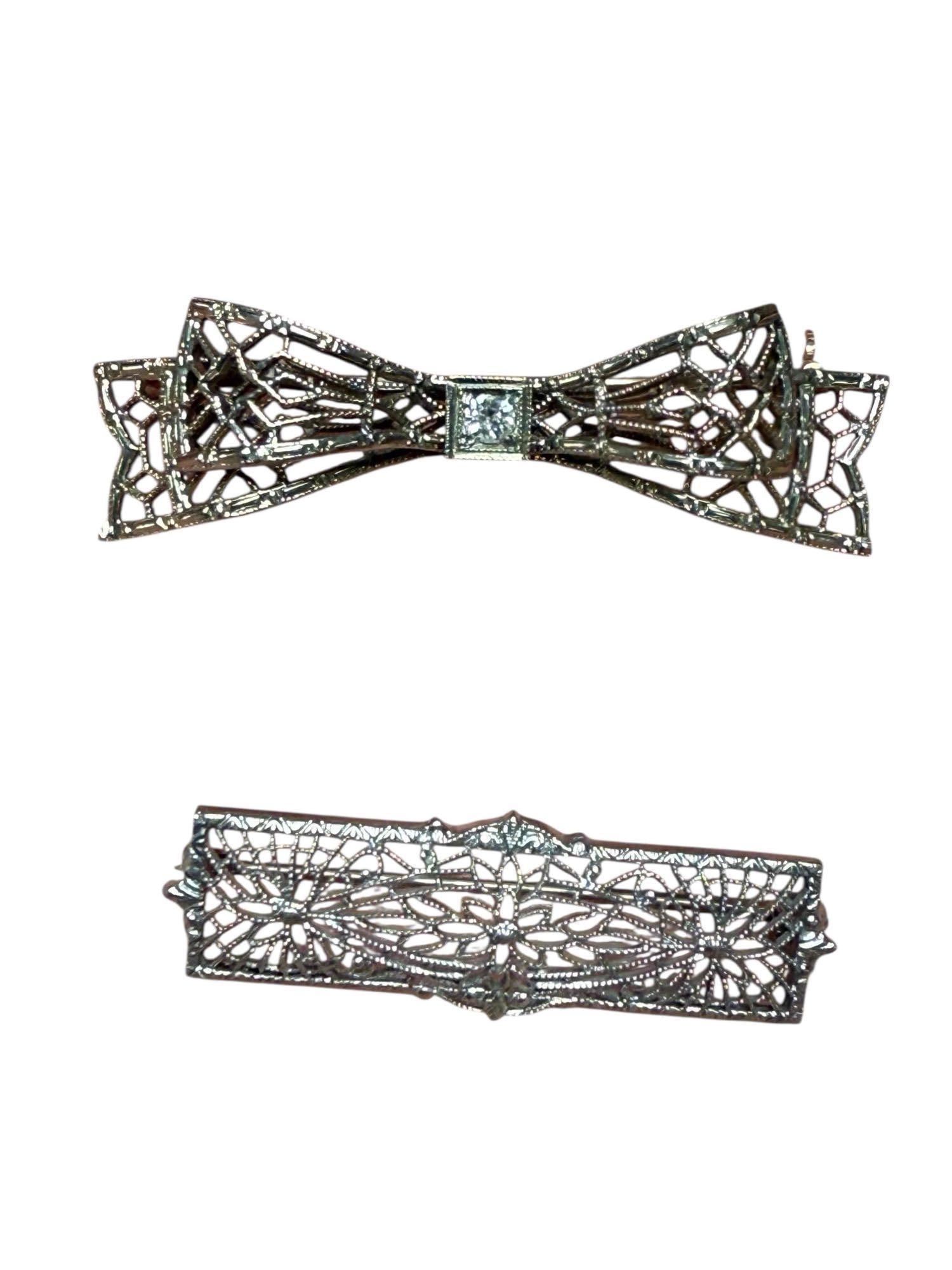 Two (2) Art Deco 14ft White Gold Pins: Two 14 karat white gold pin / brooches. Total weight 3.8 grams. Very good condition, as shown see photos