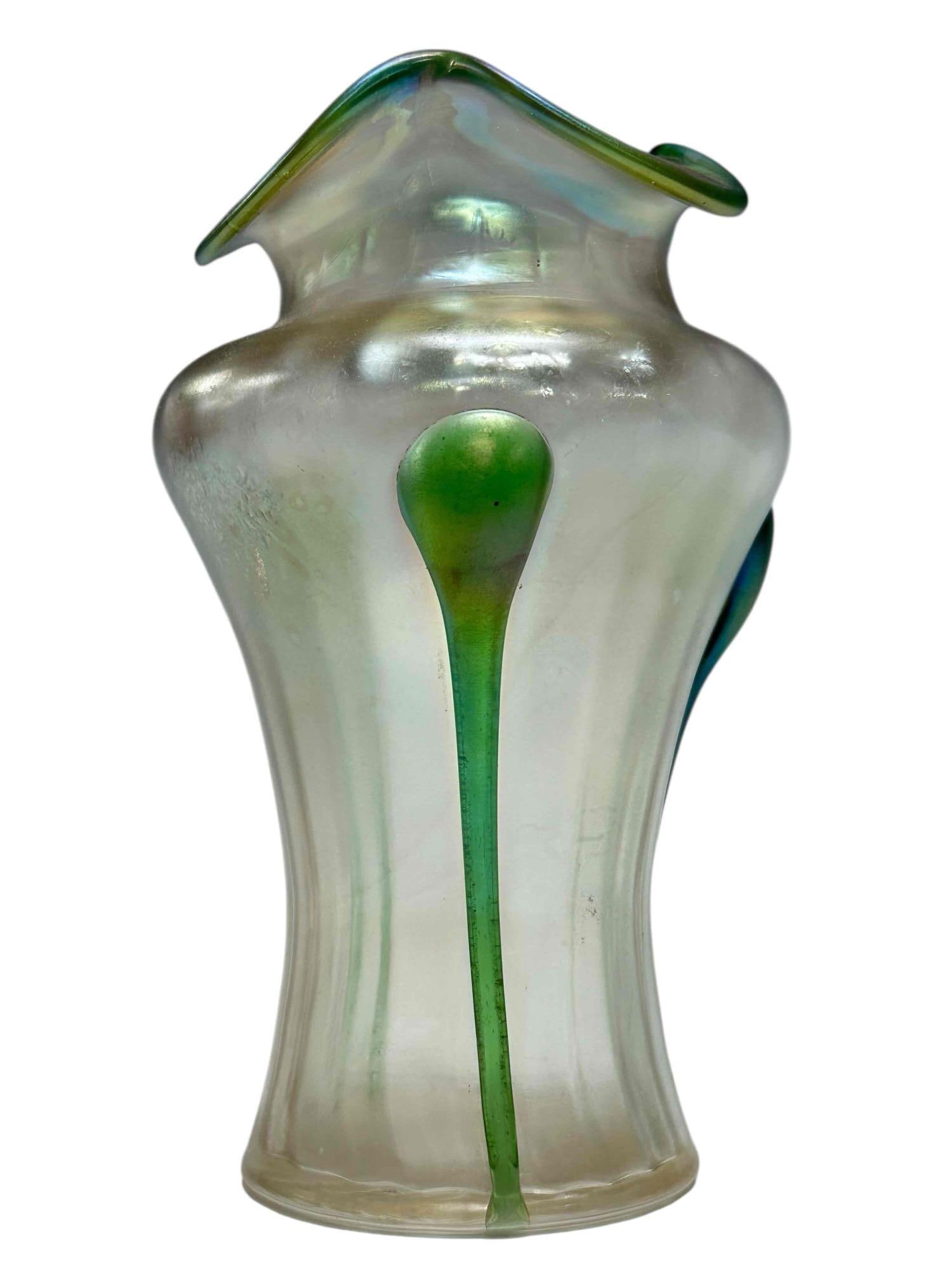 Kralik Art Nouveau Art Glass Tadpole Vase: Early 20th century Kralik Art Nouveau art glass tadpole vase. Wilde scalloped rim vase is decorated with applied and pulled green tadpole forms over a iridescent frosted body. Measuring approx. 6.75"