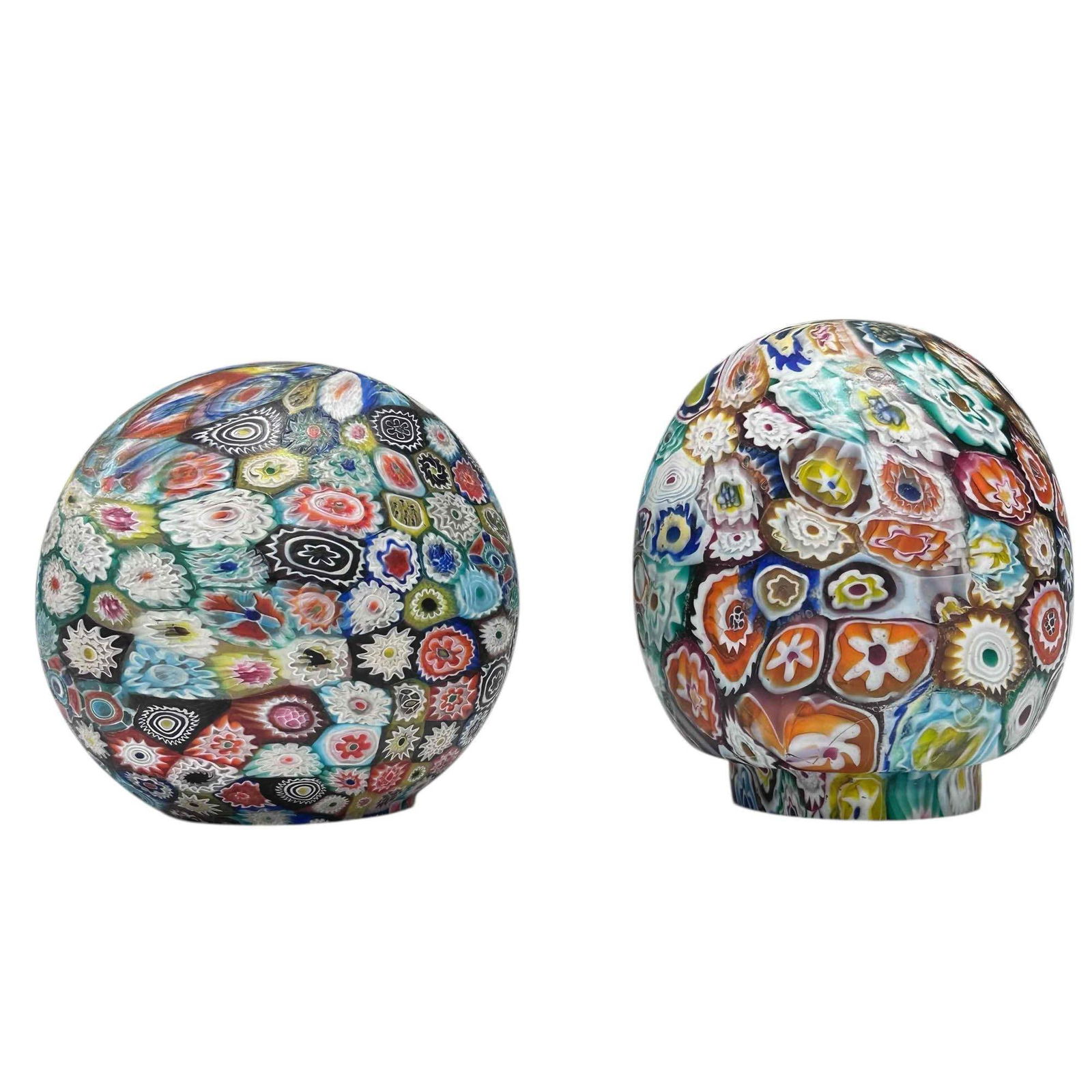 Millefiori Art Glass Ball and Egg Form Shades (2): Two millefiori art glass shades with one having ball form 4.25" tall with 2" fitting opening and second being egg or oblong form 4.5" tall with 2.25" fitting opening. In good condition with oblong hai