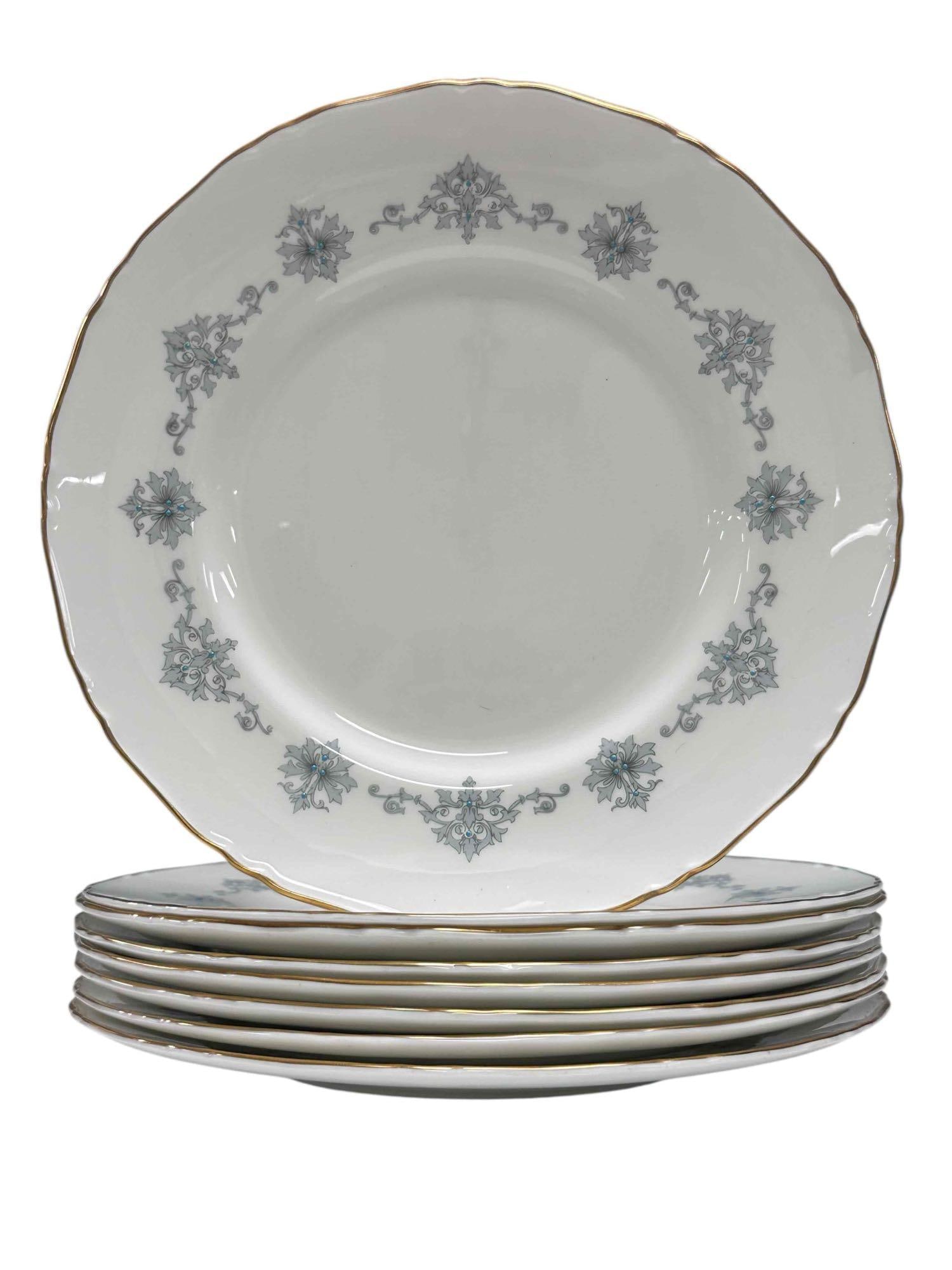 Royal Worcester "Blue Medallion" Dinner Set: The "Blue Medallion" pattern by Royal Winchester is a blue/grey floral garland design with raised blue dots and a gold rim. Made of bone China manufactured in England. This set of 8 is in good conditi