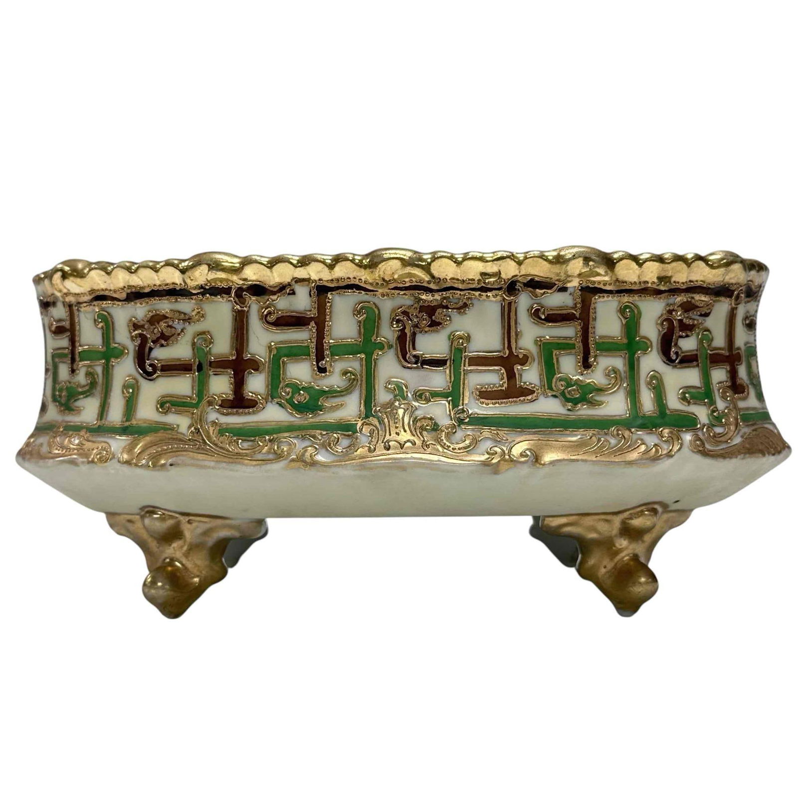 19th Century Geometric Oblong Raised Footed Bowl: Oval shaped footed bowl with geometric green and brown fretwork border with a Chinese flare. Measuring approx. 3.75" tall by 8.5" long by 6" wide. In good age appropriate condition, see photos.