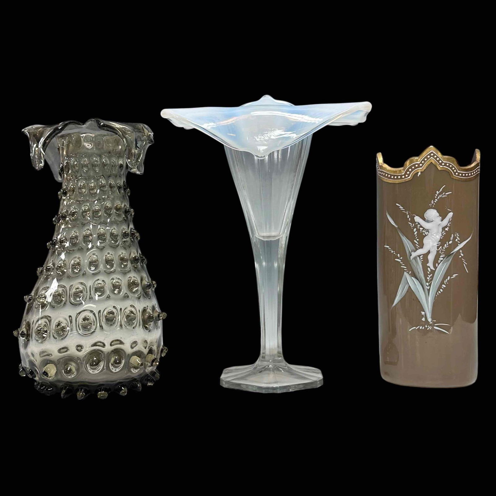 3pc Vase Hobnail Art Glass Collection Lot: Collection of 3 flower vases. Smoked glass textured Hobnail with notched or split rim. Measures 9.5" x 5". Opalescent glass "Jack in the Pulpit" 11" vase. and a brown-cased English art glass vase. All