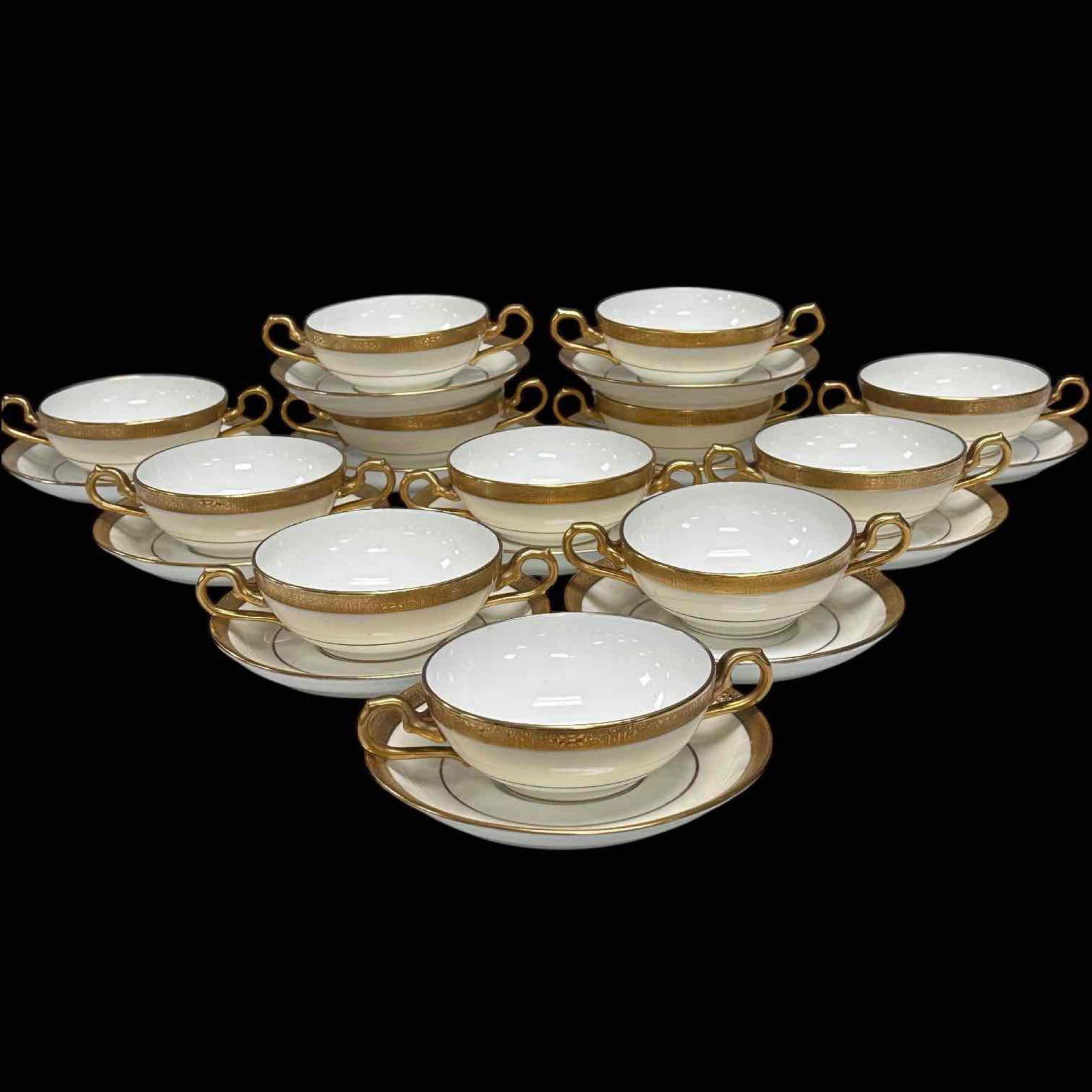George Jones and Son Cresent Cream Soup Bowl and Saucer Set: 12 George Jones and Sons soup bowls and saucers sets. It can double as a cup and saucers, but is designed as soup bowls for the low bowl height and double handles. Gold-encrusted band running the bord