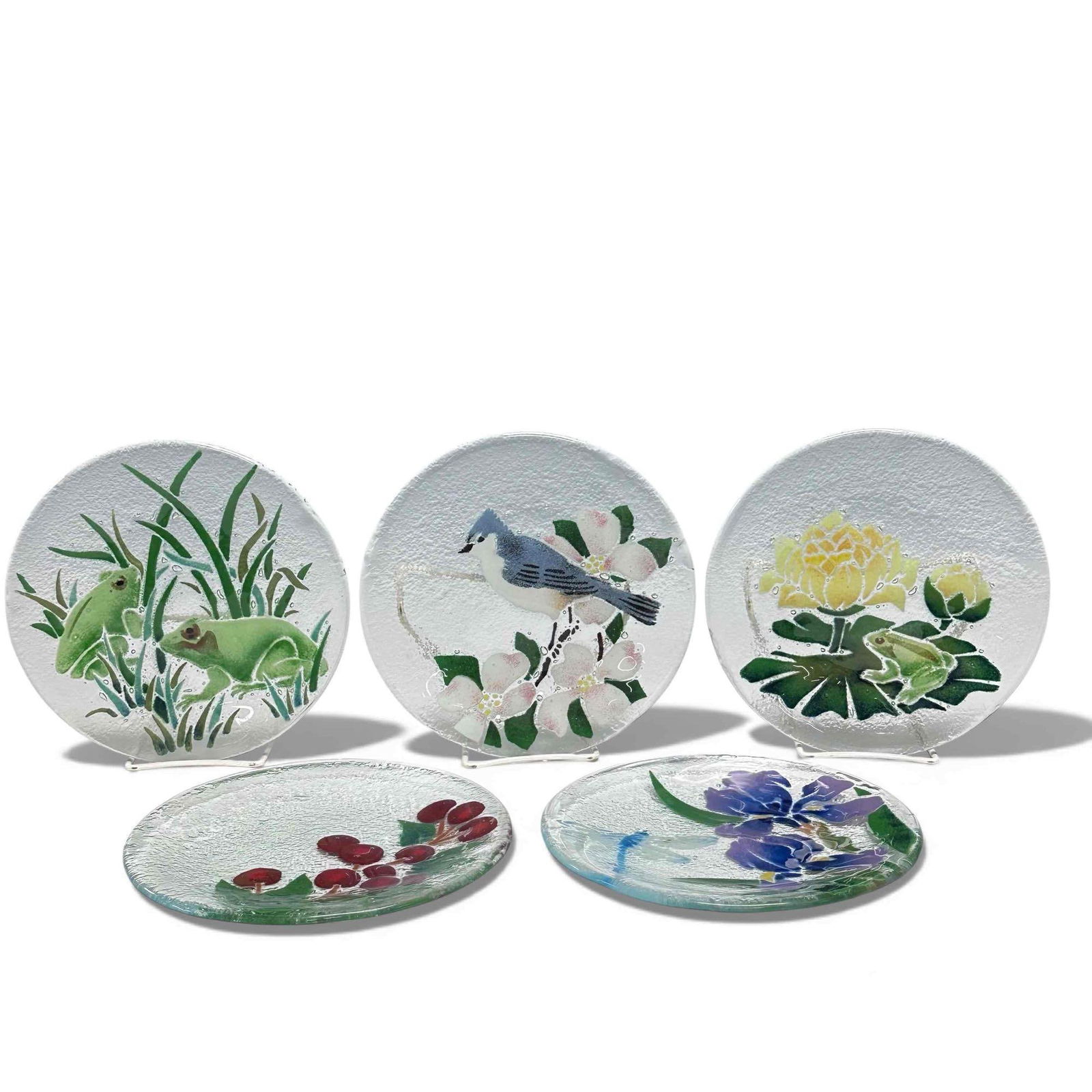 Peggy Karr Fused Art Glass Nature Wildlife Plates (5): Collection of five Peggy Karr fused art glass wildlife and plants plates. Depicting dragonfly and purple flower, bullfrogs in the grass, blue jay perched on blossoming tree branch, cherry tree branch