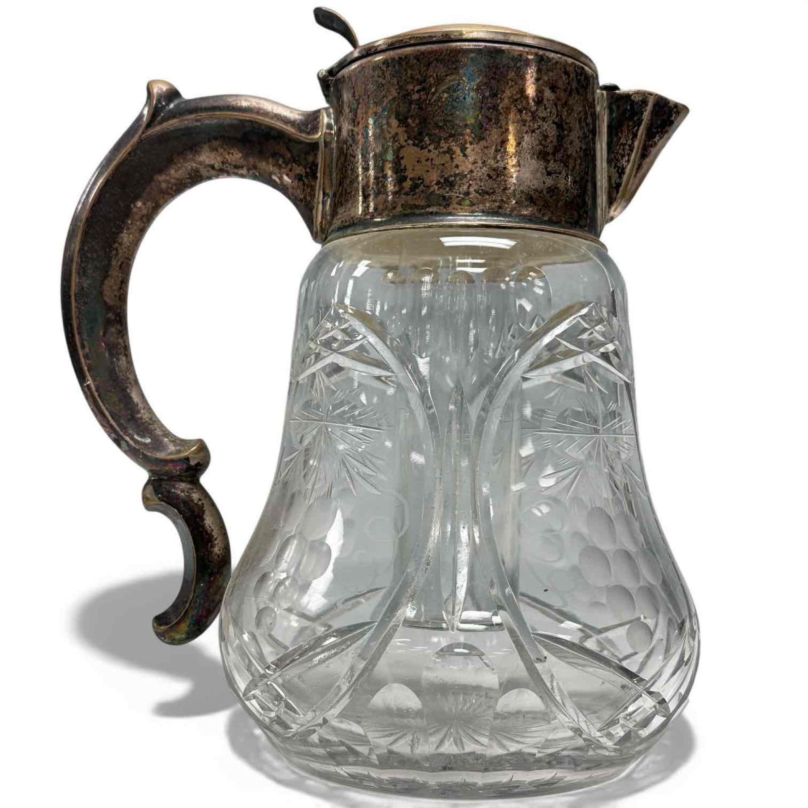 Grape Motif German Cut Crystal Lemonade Pitcher with Ice Insert: Victorian era thick cut crystal decanter with glass insert ice cube tube. Cut crystal with etched grape motif on bell shaped body with starburst base. Stamped on neck Silverplated Germany U.S. Zone. M