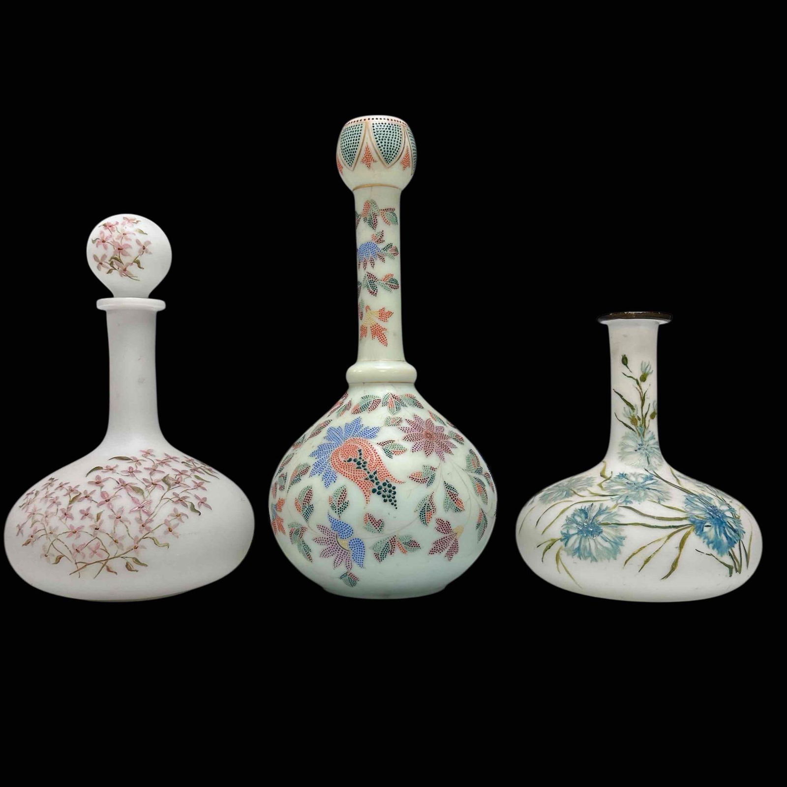 Harrach Uranium Custard and Milk Glass Enameled Decanters and Vase (3): Late 19th early 20th century Harrach uranium custard glass hand painted beaded floral enameled decor with bulbous base and neck opening 12" tall, Victorian milk glass decanter in floral pattern with s
