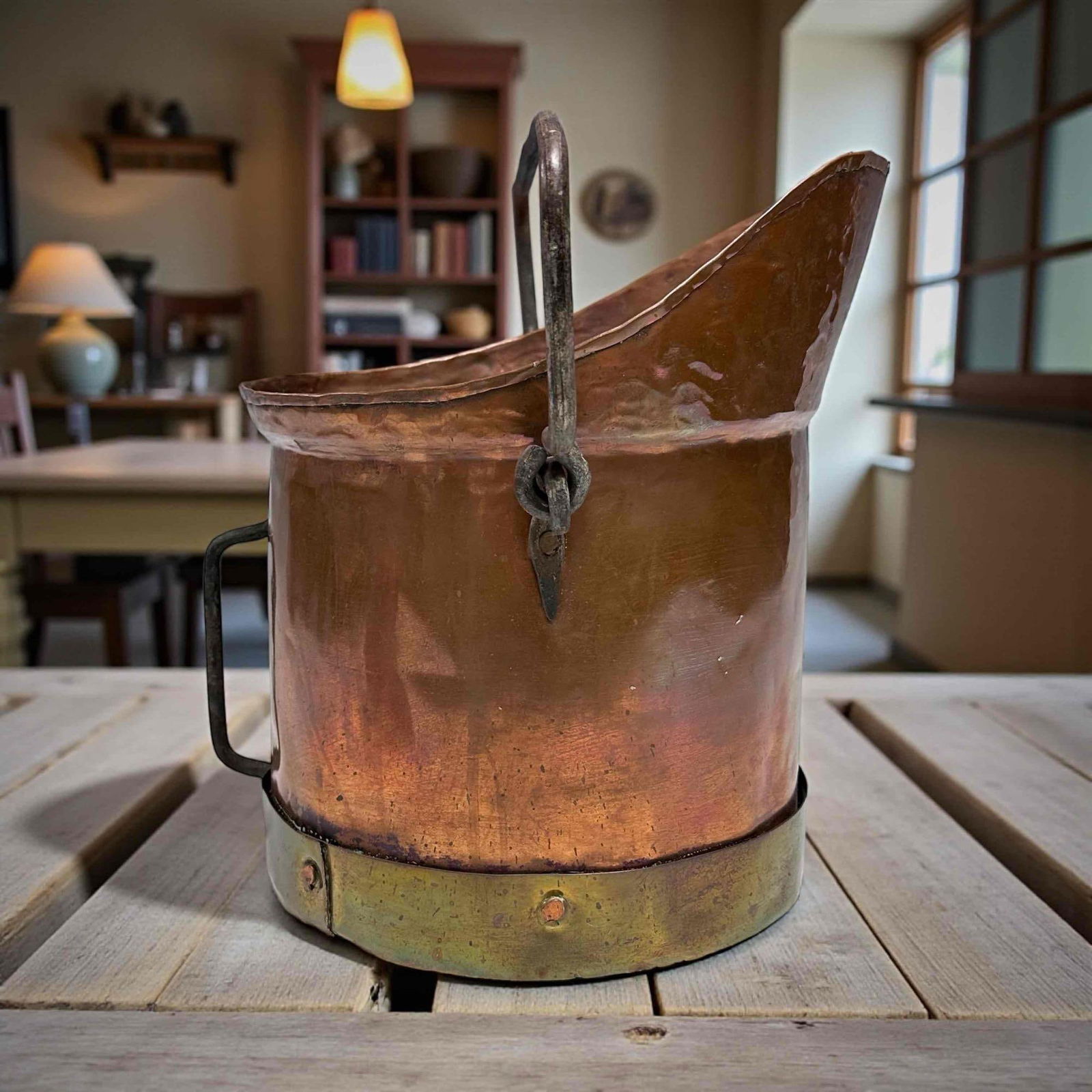 Hammered Copper Coal Scuttle: Very neat, hammered copper coal scuttle or bucket. With cast iron handles and a brass ring rimmed bottom. Great piece for a collector, train fans or a decorative fireplace piece. Measures 12" tall, 13