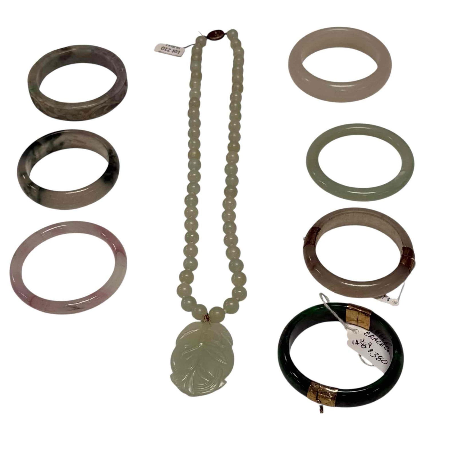 Jade Jadeite Bangle Bracelets and Necklace Multi-Shades (8): Carved fruit pendant on beaded necklace with silver clasp 24" long, white and green bracelets with 14k gold filled clasps 3 1/8" wide, carved Burmese bangle bracelet 3 1/8" wide and four white, green