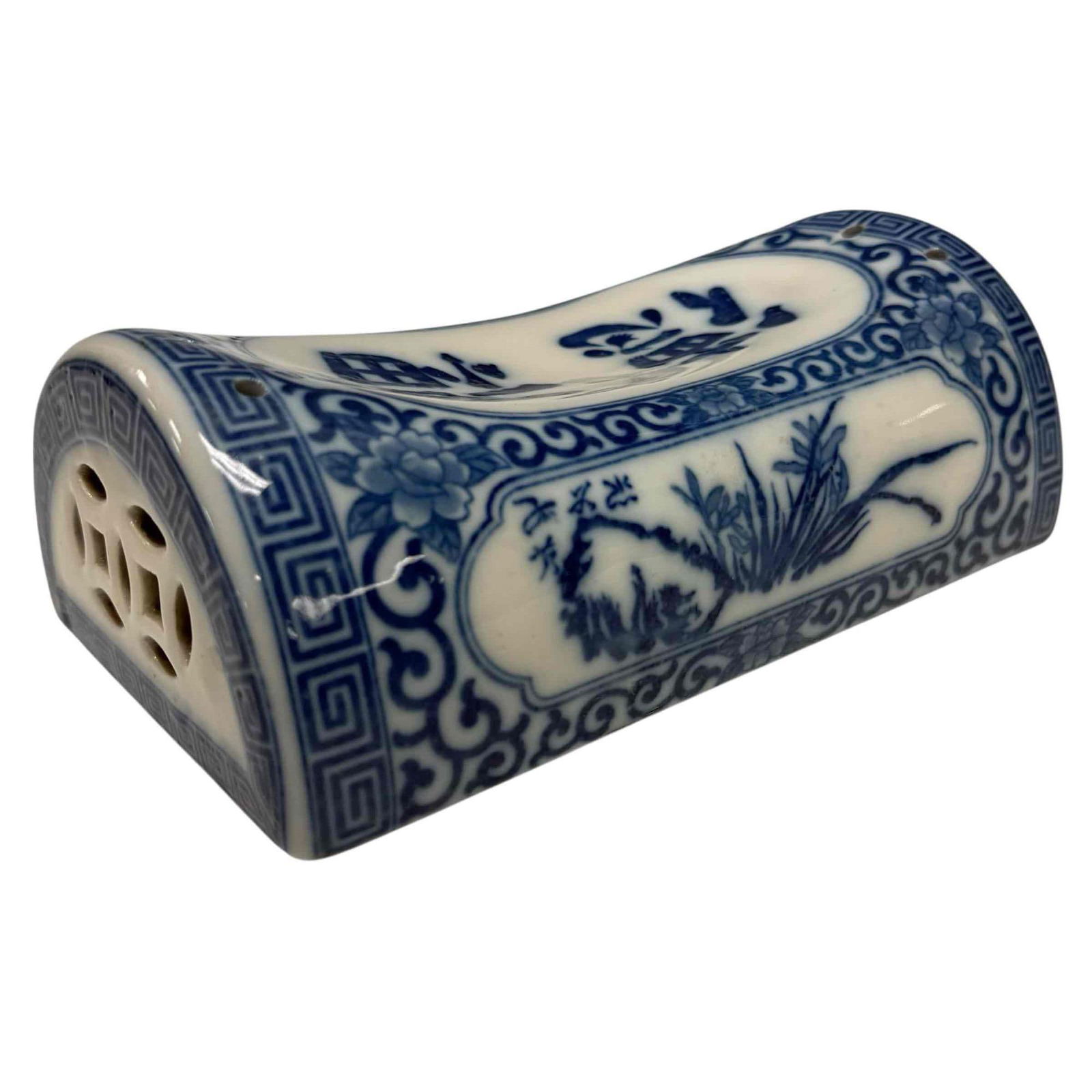 Japanese "Takamakura" Blue and White Porcelain Pillow: Blue and white takamakura or Japanese porcelain pillow. Primarily used by Maiko and Geisha to keep their hair intact for several days to a week. Measuring approx. 3" tall by 8.5" wide by 5" deep. In g