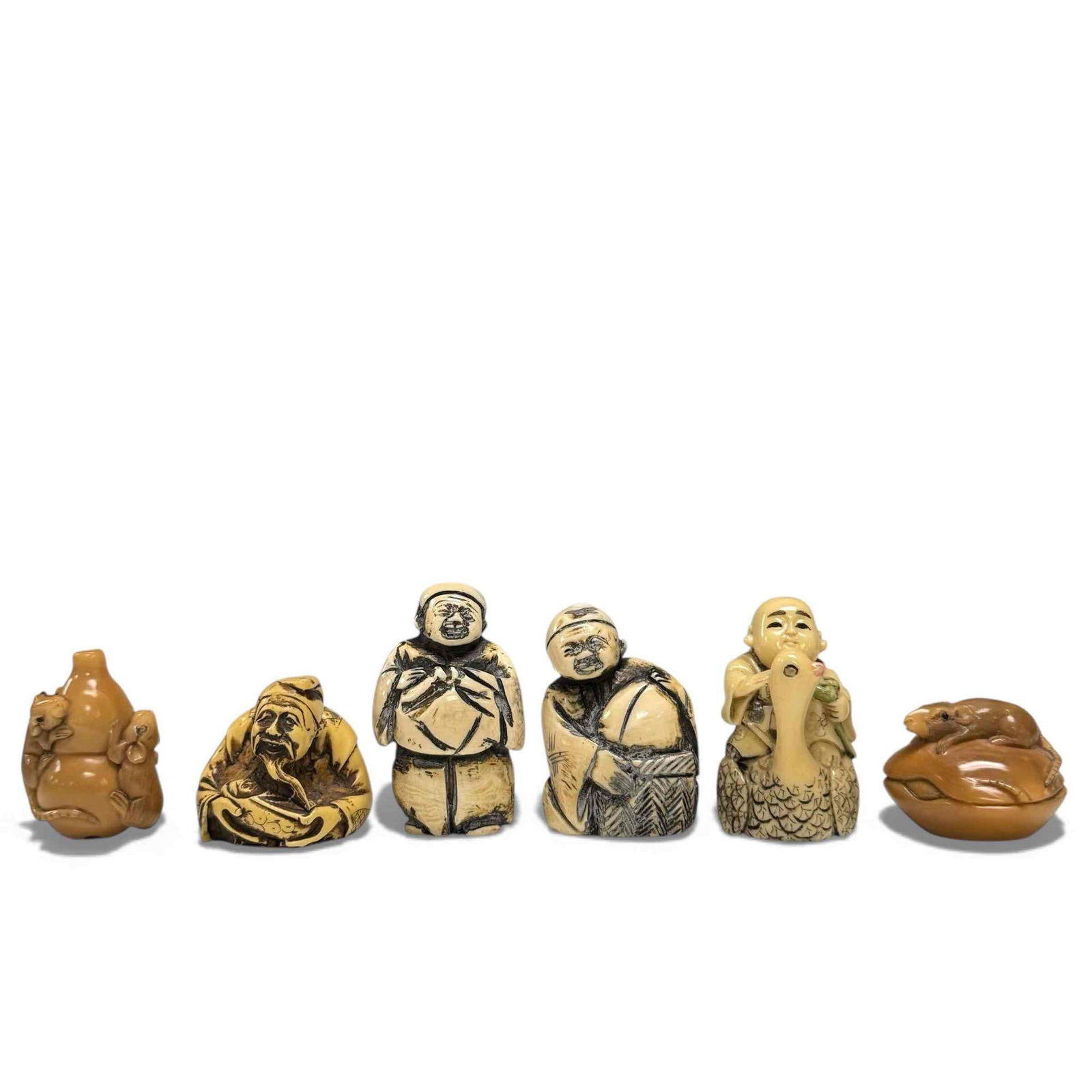 Japanese Netsuke Carved Figural Pendant Pieces (6): Japanese netsuke carved piece including; rats on a clam, rats on a vase, man holding baby, man/baby riding swan and two men carrying baskets. Having holes to be worn as pendants or beads. Measuring ap