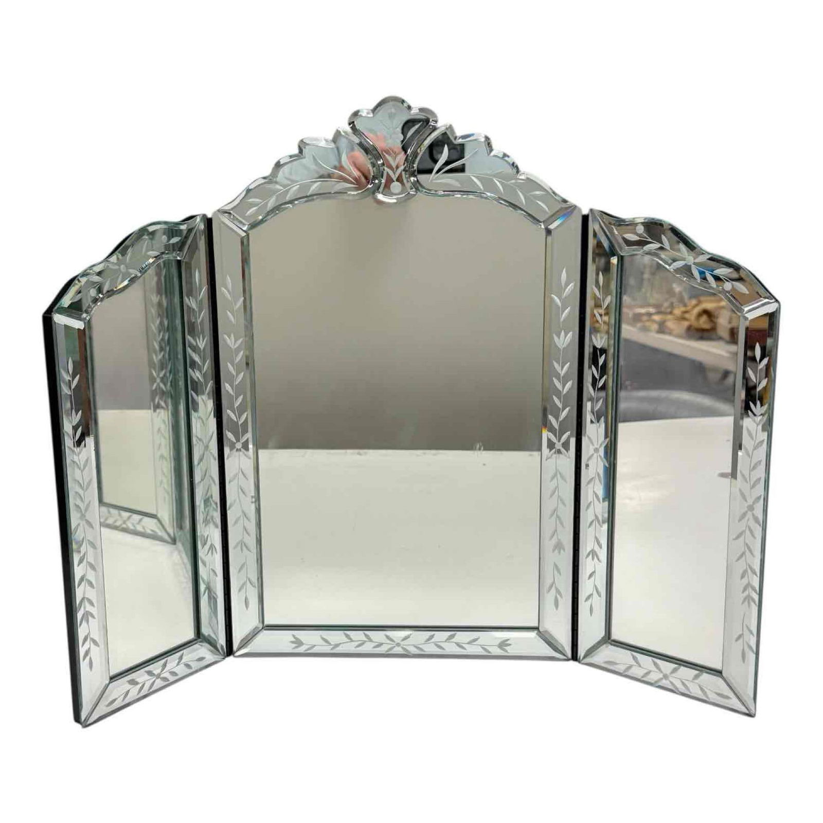 Venetian Beveled and Etched Tri-Fold Mirror: Venetian tri-fold vanity wall mount or dresser top etched glass beveled mirror on black painted wood back. Measuring approx. 16.5" tall by 21.5" wide fully expanded. In good age appropriate condition
