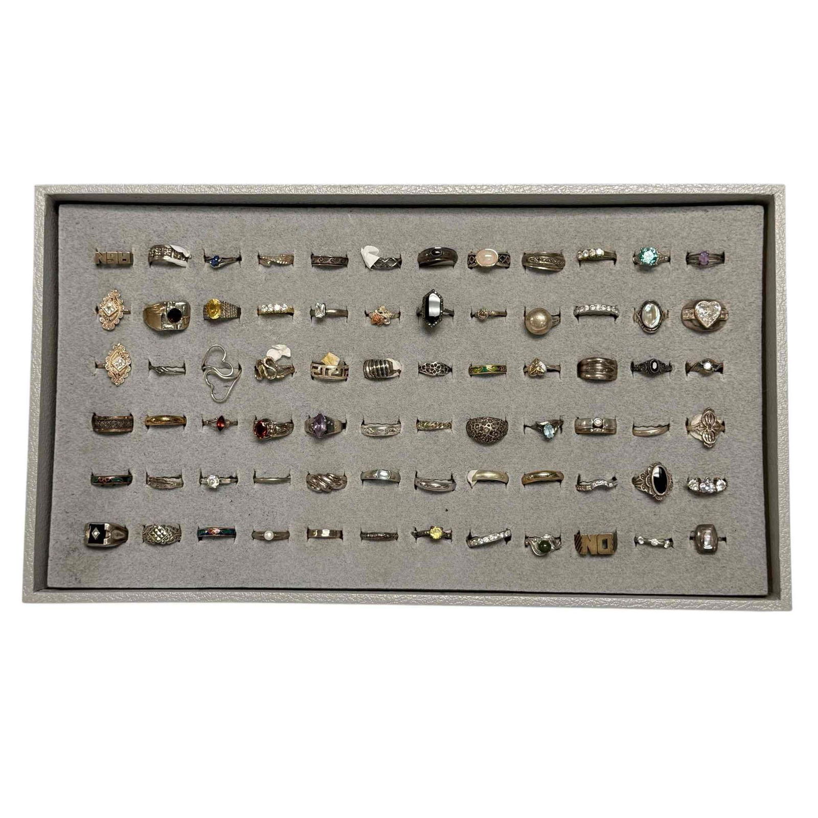Tray of 72 Mostly Sterling Silver Rings: Group of 72 mostly sterling silver rings. Some cloisonne, semi-precious stone, rhinestones with different styles and designs. Tray is not included. In good condition, see photos.