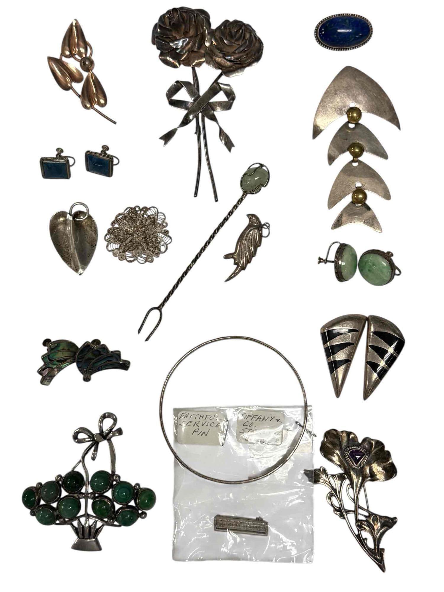 Contemporary Tiffany and Floral Sterling Silver Jewelry: Tiffany and Co. Faithful Service pin 1" wide, large two flowers tied with ribbon 4.25" tall, Malachite green bouquet brooch 2.75" tall, contemporary four panel articulated fish earring 3.25" long, art