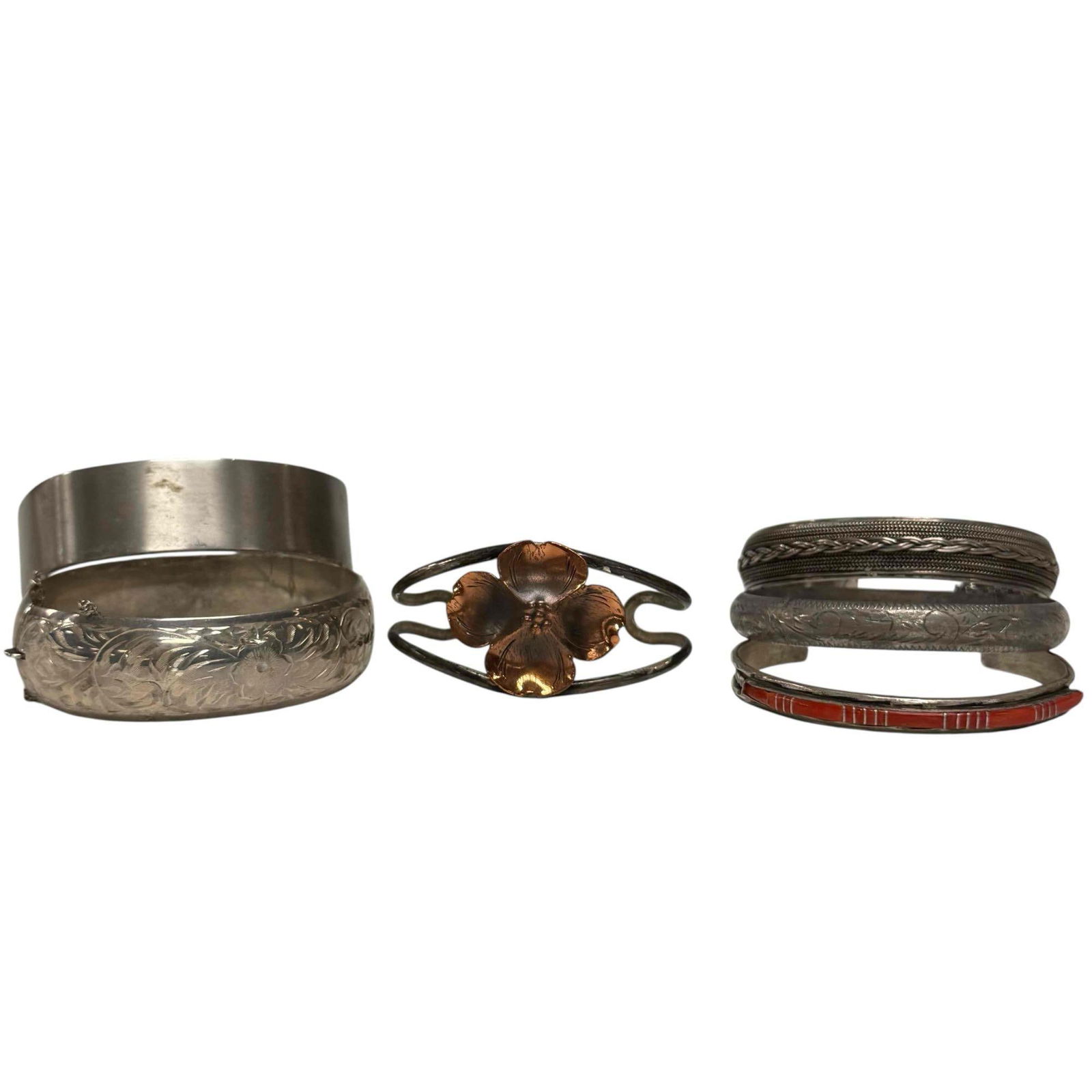 Sterling Silver Cuff and Bangle Bracelets (6): Including; signed Zuni L. Bowannie "Shewe" red coral 2.5" wide, Nye sterling with copper dogwood flower 2.5" wide, twist braided 2.5" wide, B.A.B. plain matte sterling cuff 2.75" wide and two etched s
