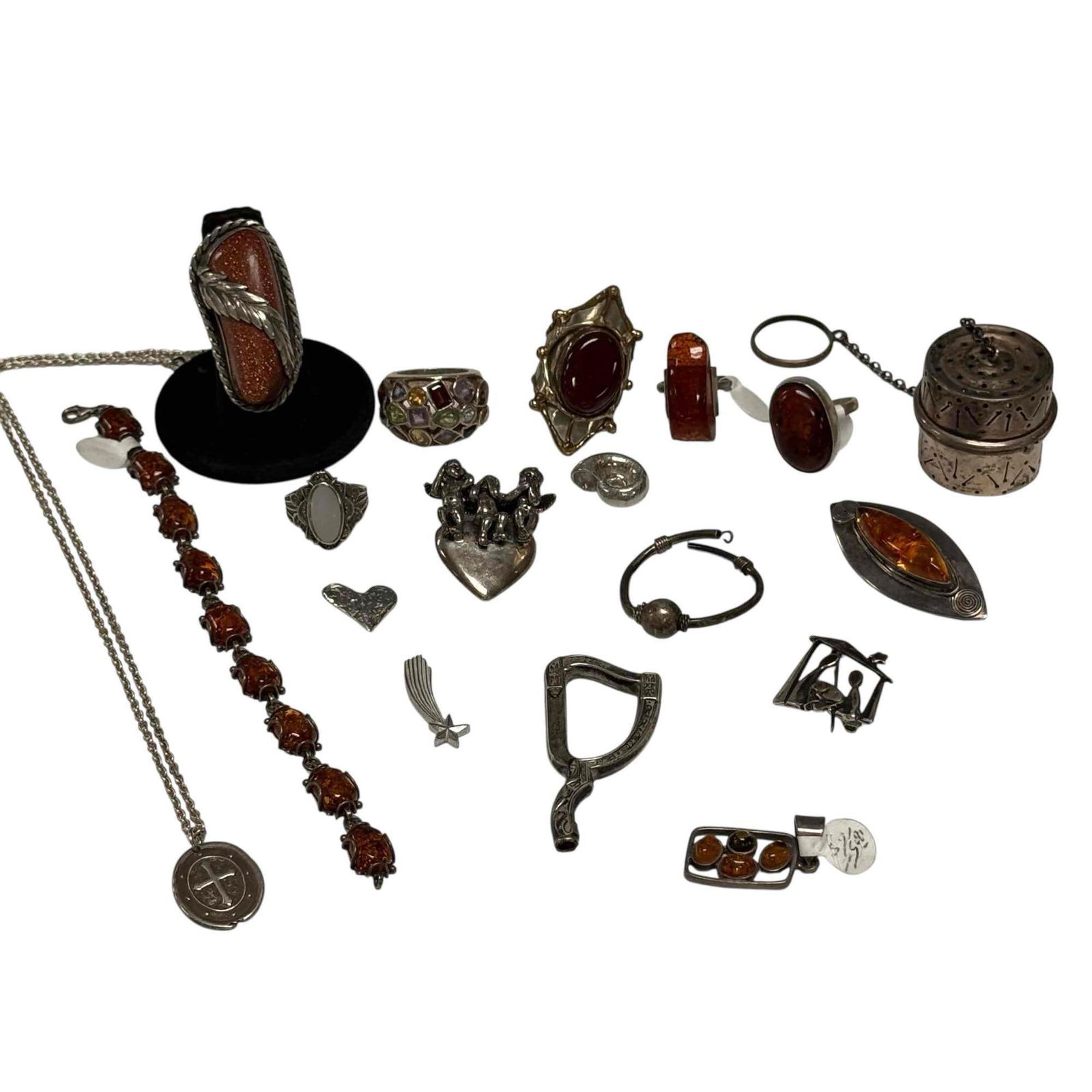 Goldstone Amber and Sterling Silver Jewelry Lot: Includes; Amber link bracelet 7" long, large goldstone feather ring 2" long size 8.25, Brutalist web cabochon garnet ring size 7, See no evil Hear no evil Speak no evil cherubs on heart pendant, amber