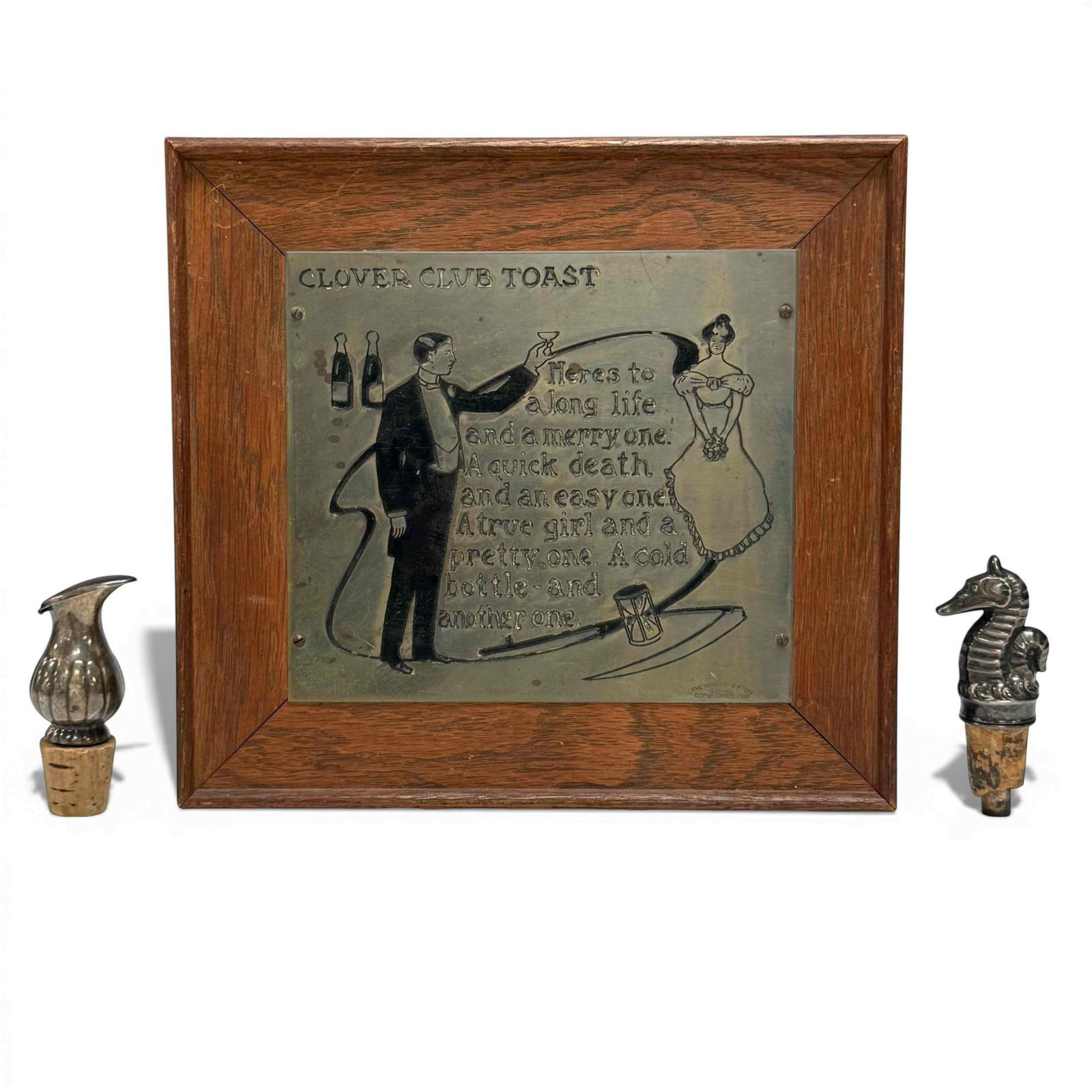 Clover Club Toast Wall Plaque with Seahorse and Ewer Stoppers: Metal framed wedding toast wall plaque 8.5" tall by 9.25" wide accompanied with vintage seahorse and ewer form cork bottle stoppers approx. 3.5" tall. In age appropriate condition, see photos.