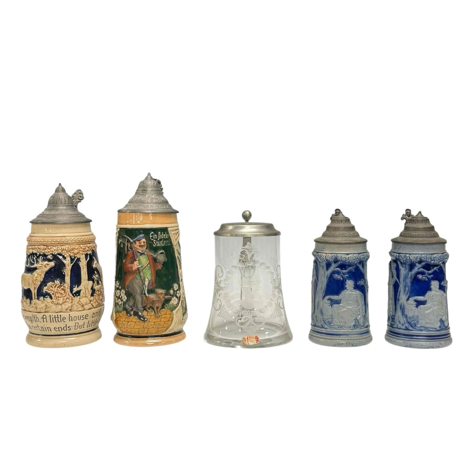 Collection of 5 Steins: Collection of 5 German stoneware steins. Featuring various scenes. A pair of cobalt blue and grey salt-glazed, with high relief and pewter lids. One does have a lit tip chip on top of the pewter lid.