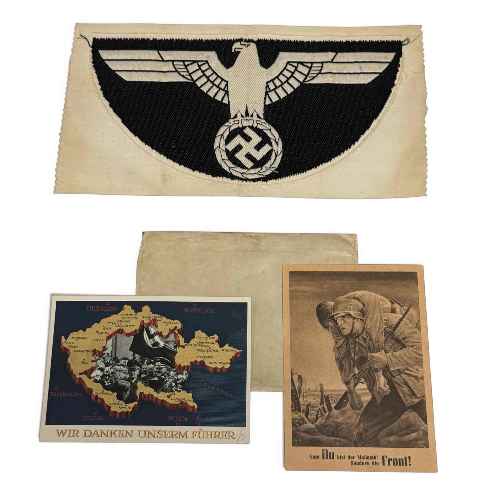 World War II German Army Memorabilia: World War II German Memorabilia lot. Large cloth patch worn on the chest of the sleeveless physical training shirts issued to German soldiers. Two mailed German postcards. One is stamped only, while t
